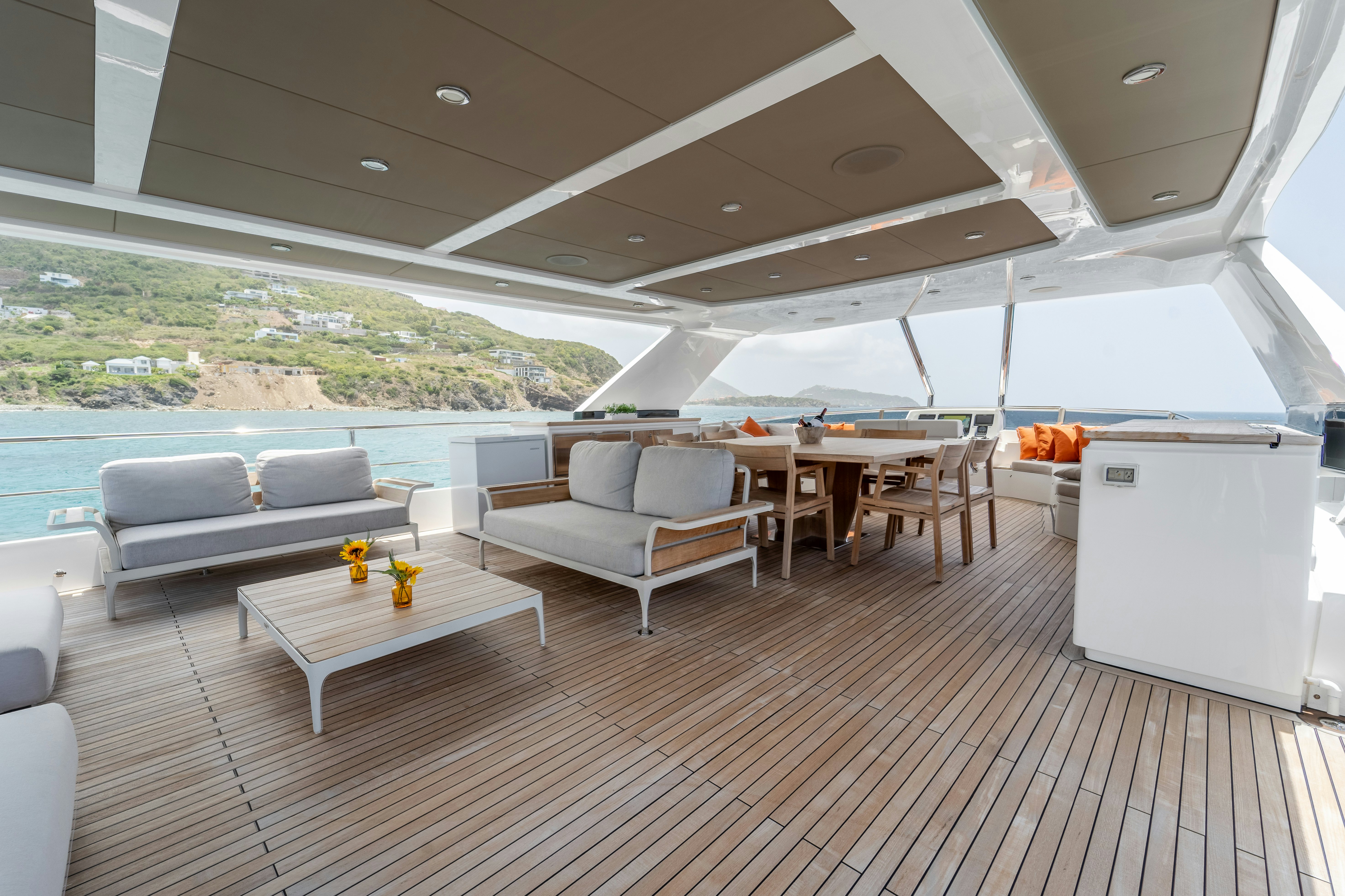 a living room with a couch and a table aboard EXIT STRATEGY Yacht for Sale