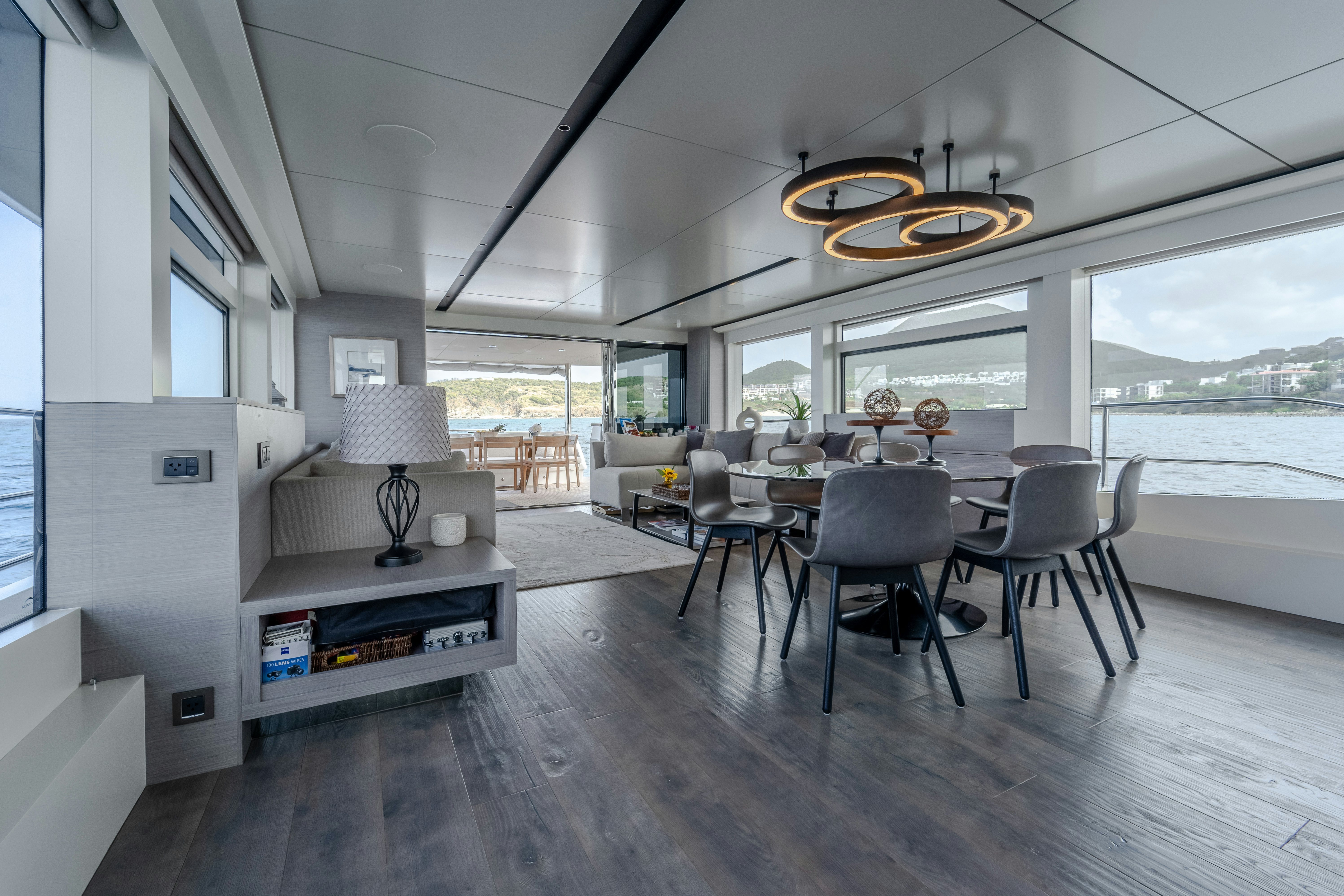 a room with tables and chairs aboard EXIT STRATEGY Yacht for Sale