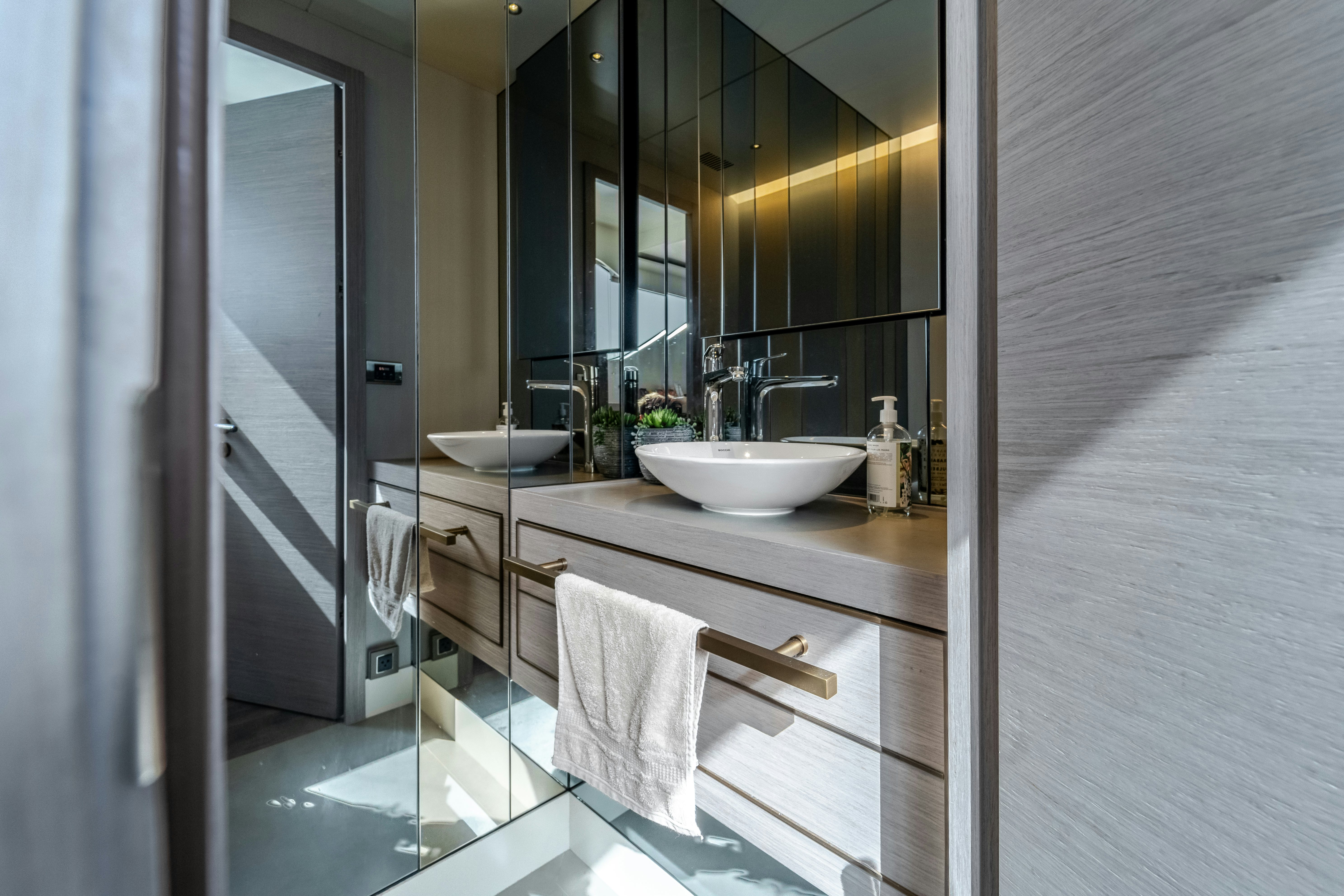 a bathroom with a sink and a mirror aboard EXIT STRATEGY Yacht for Sale