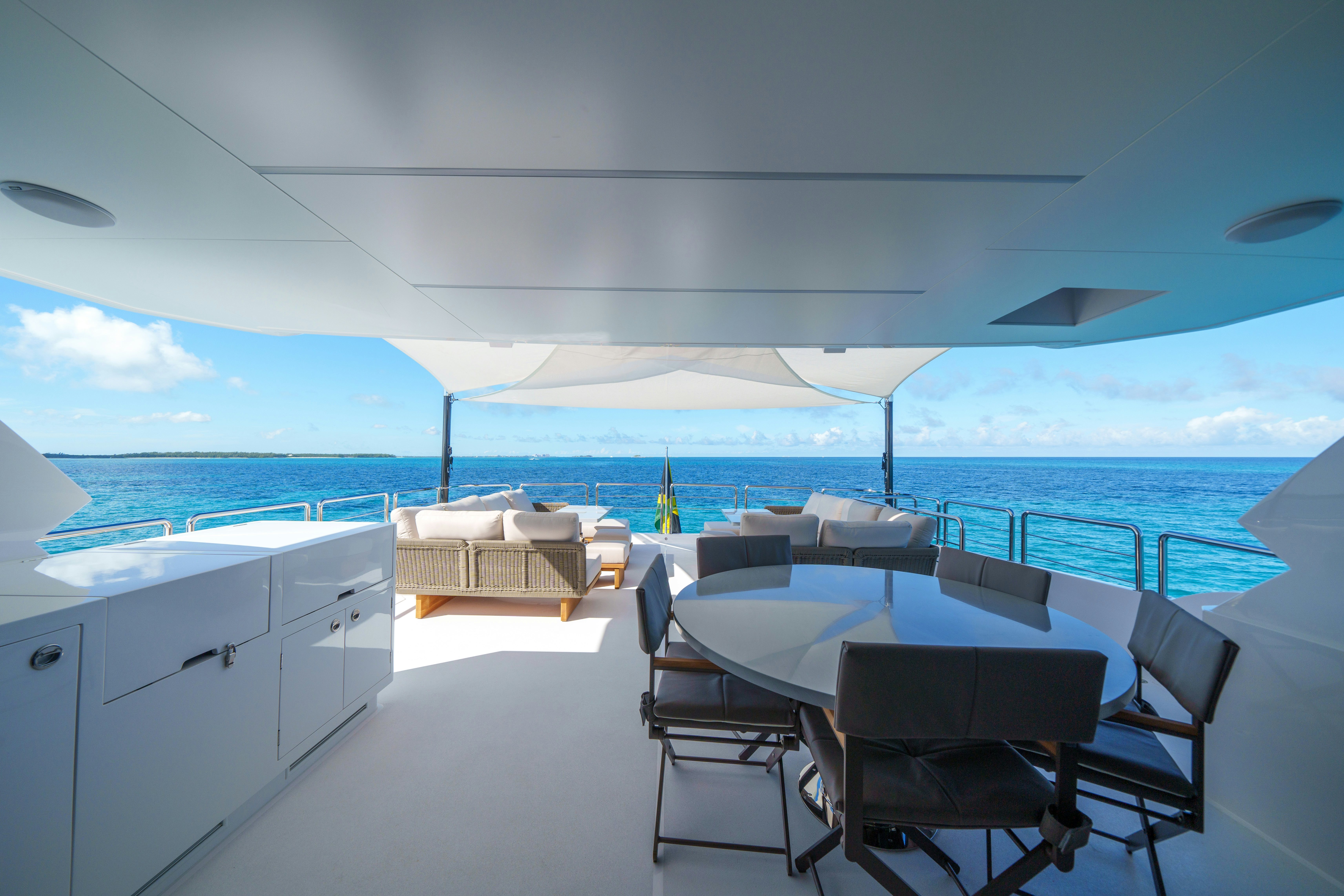 a room with a table and chairs on a boat aboard RIO Yacht for Sale