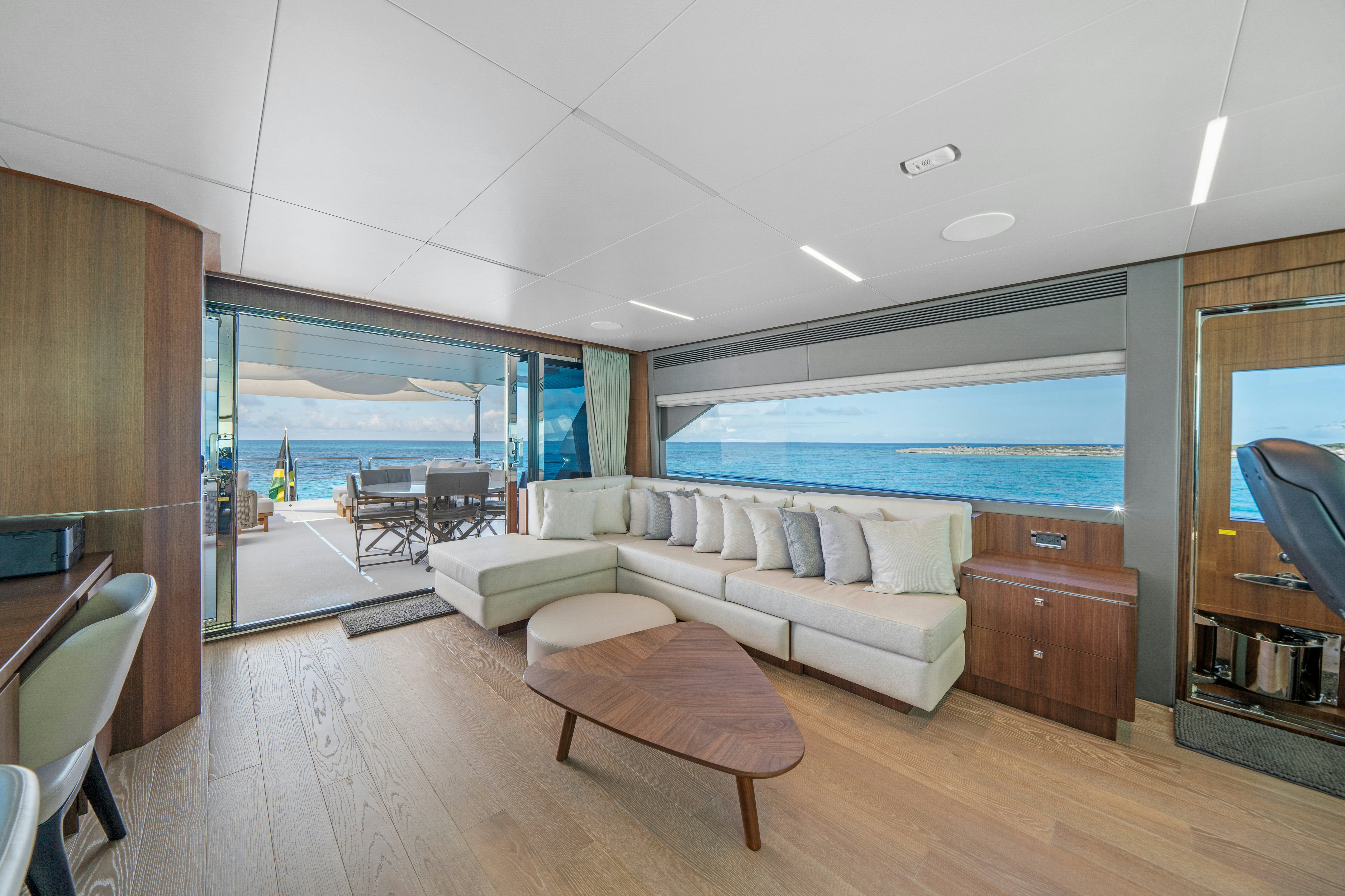 a living room with a large window aboard RIO Yacht for Sale