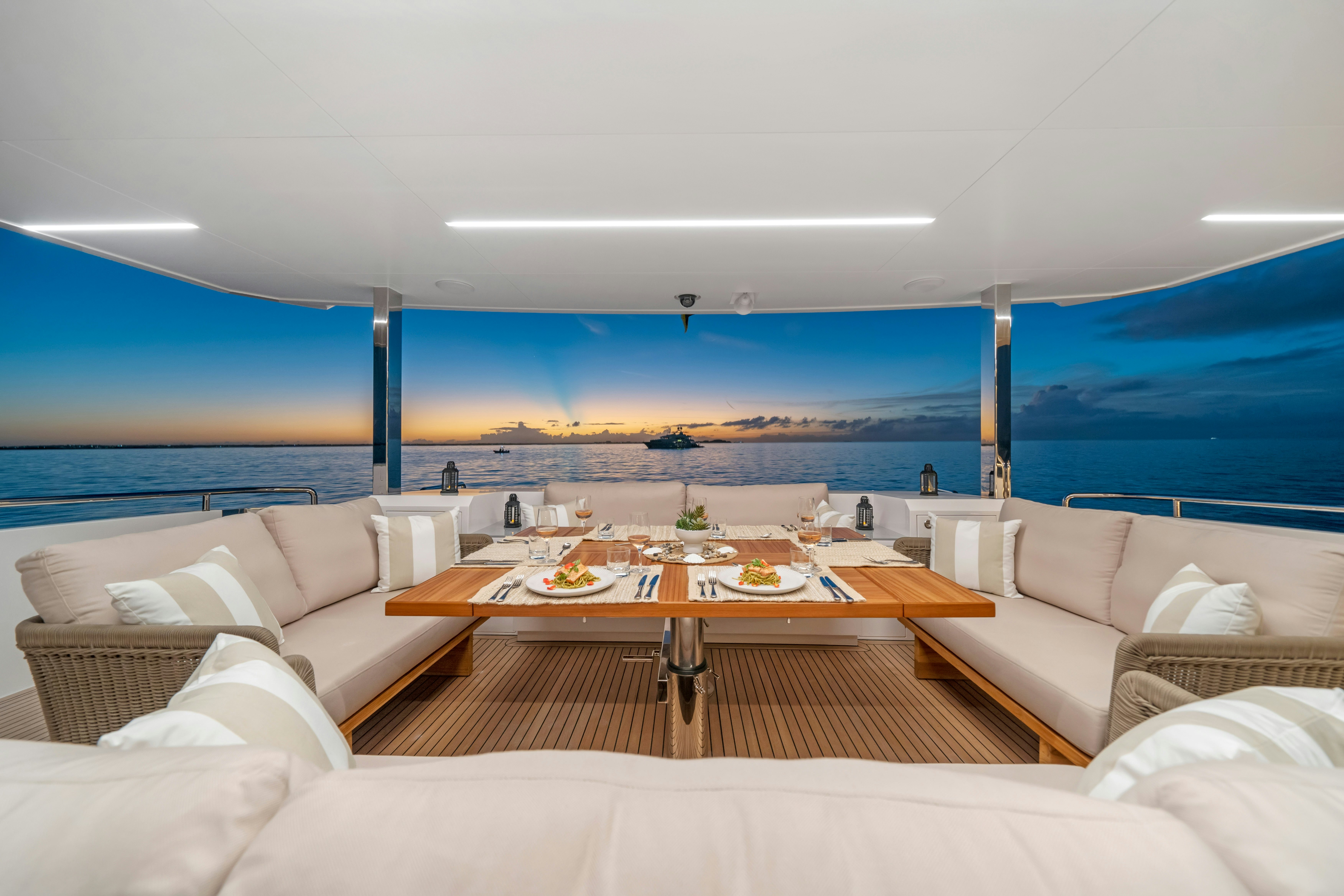 a living room with a large ocean aboard RIO Yacht for Sale