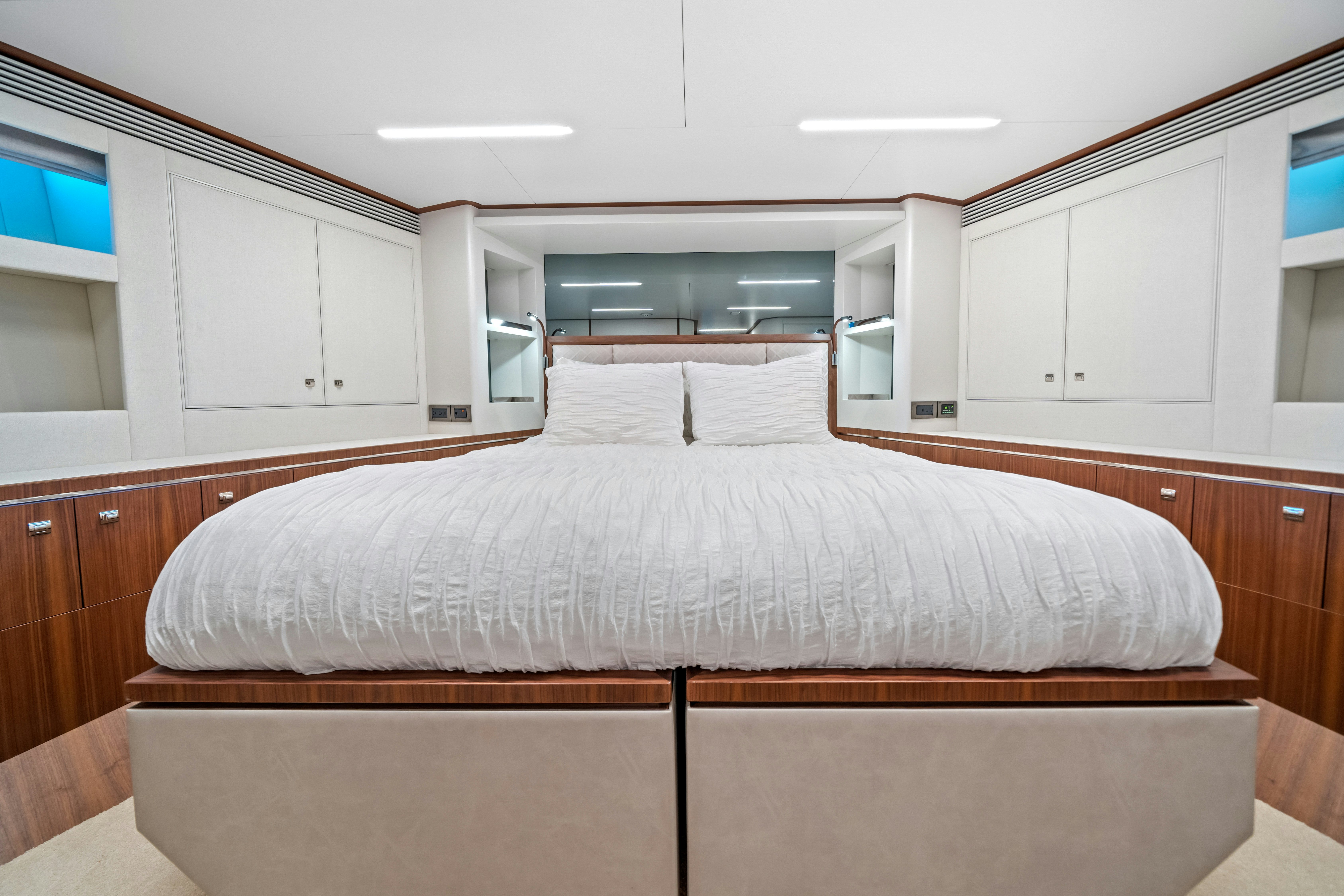 a large bed in a room aboard RIO Yacht for Sale