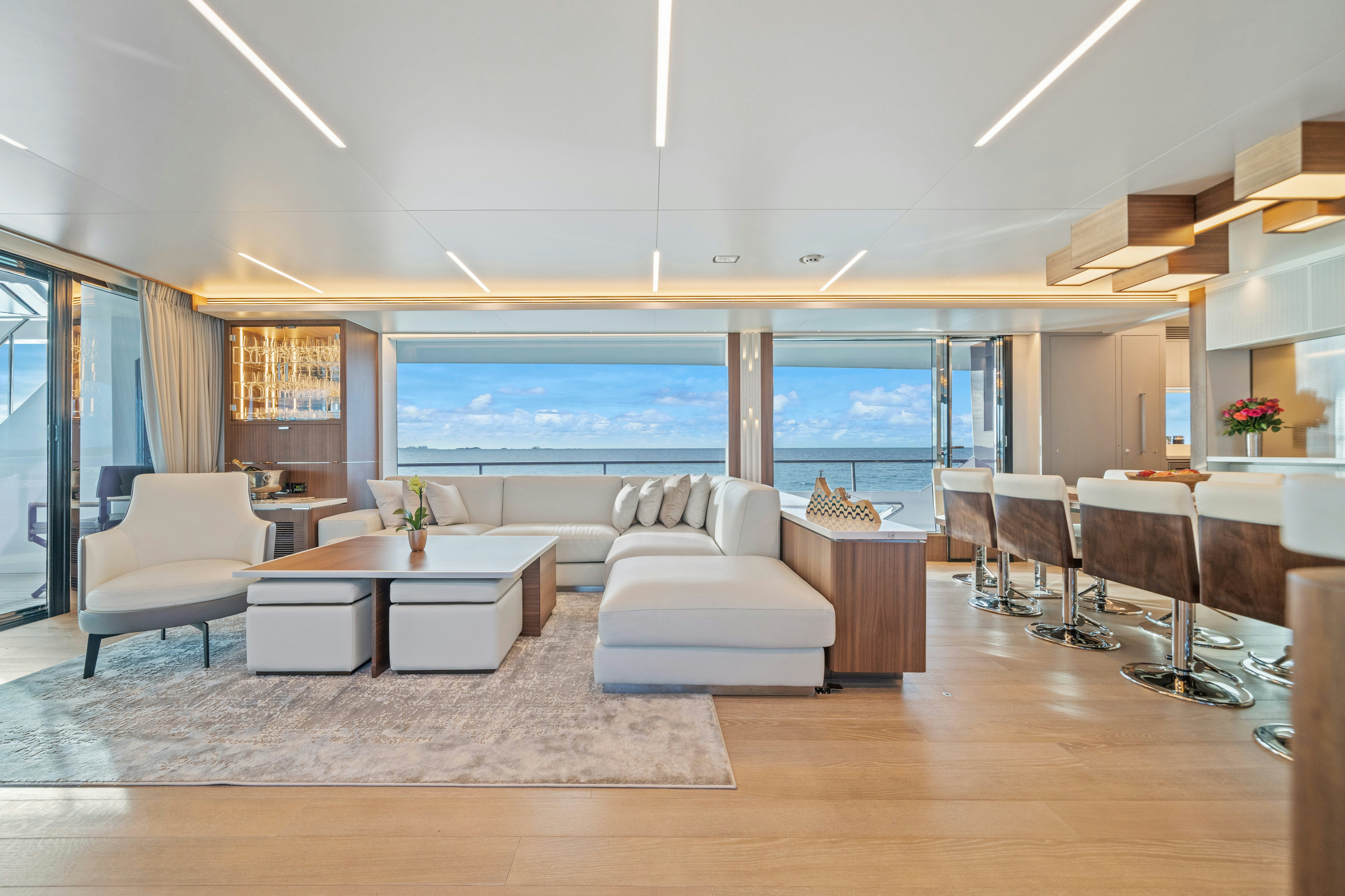 a living room with a large window aboard RIO Yacht for Sale