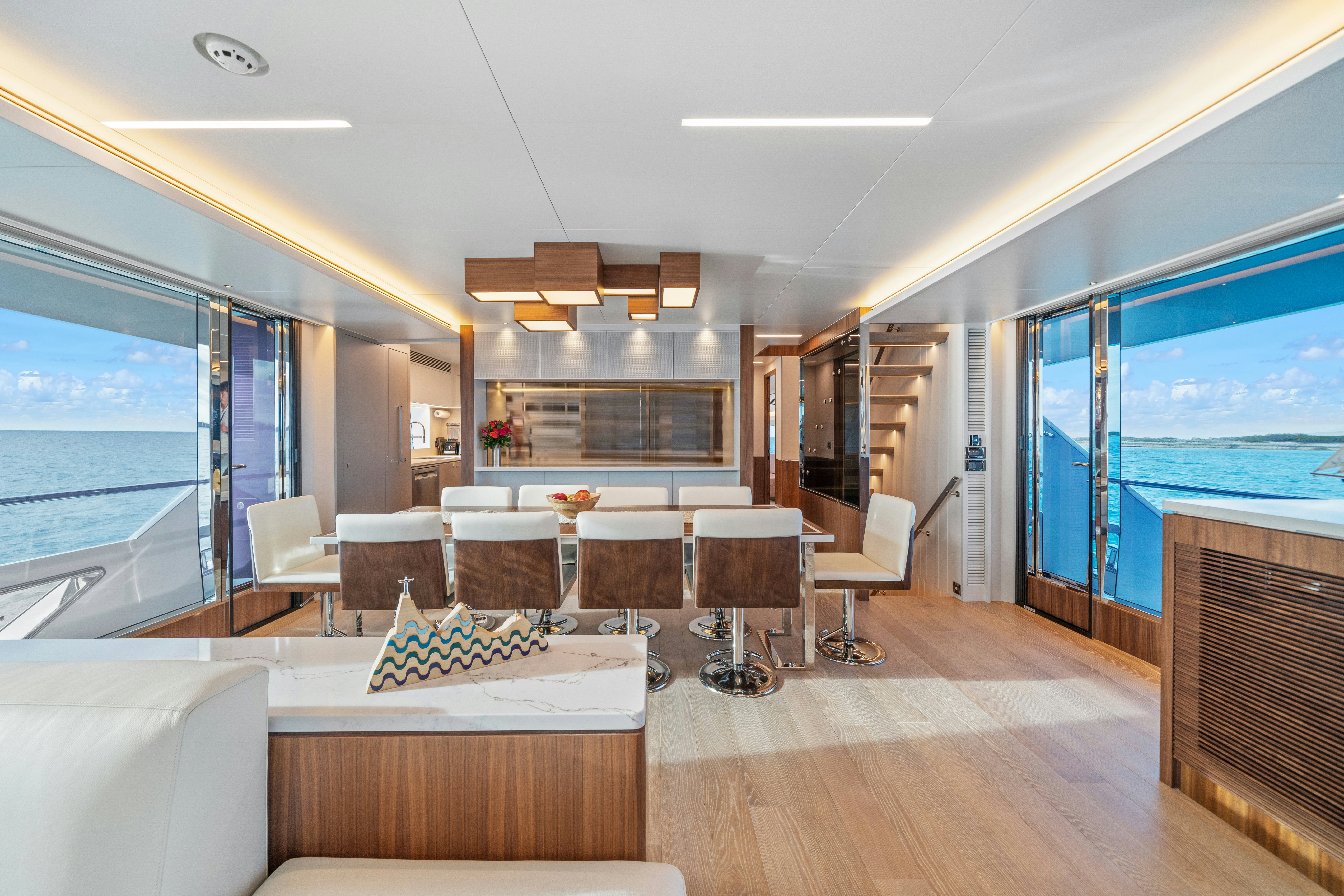 a living room with a large window aboard RIO Yacht for Sale