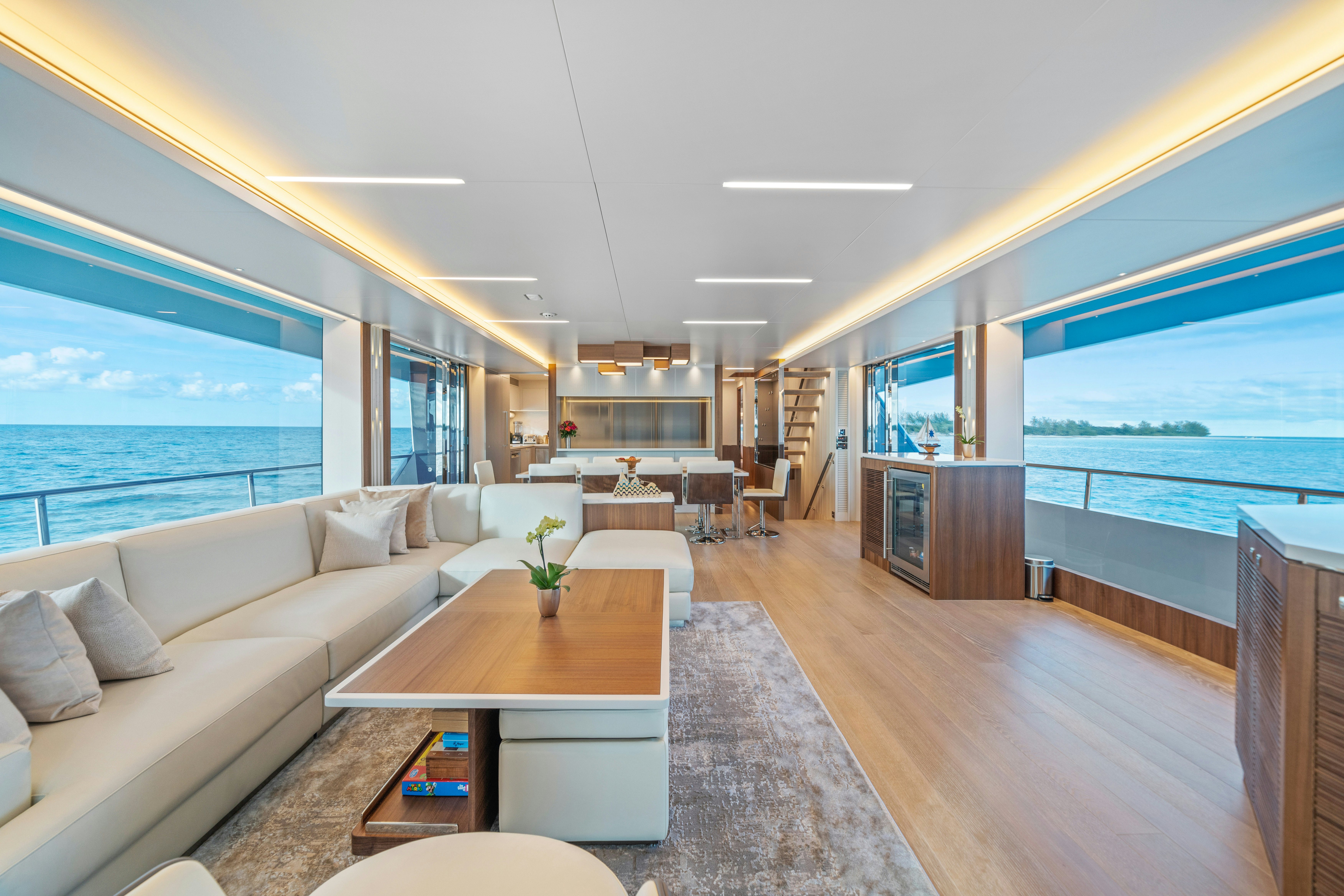 a living room with a large window aboard RIO Yacht for Sale