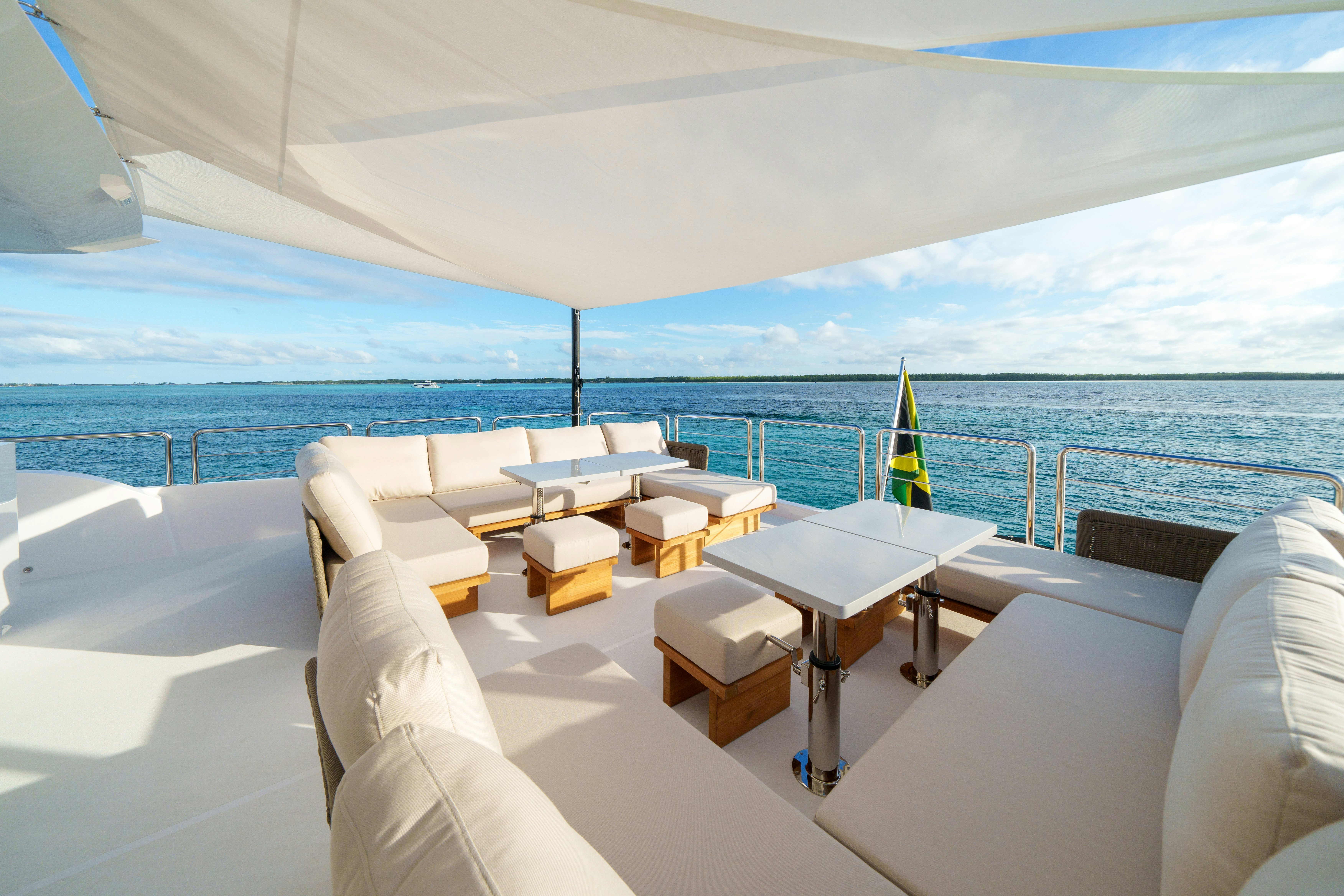 a room with a view of the ocean and a beach aboard RIO Yacht for Sale