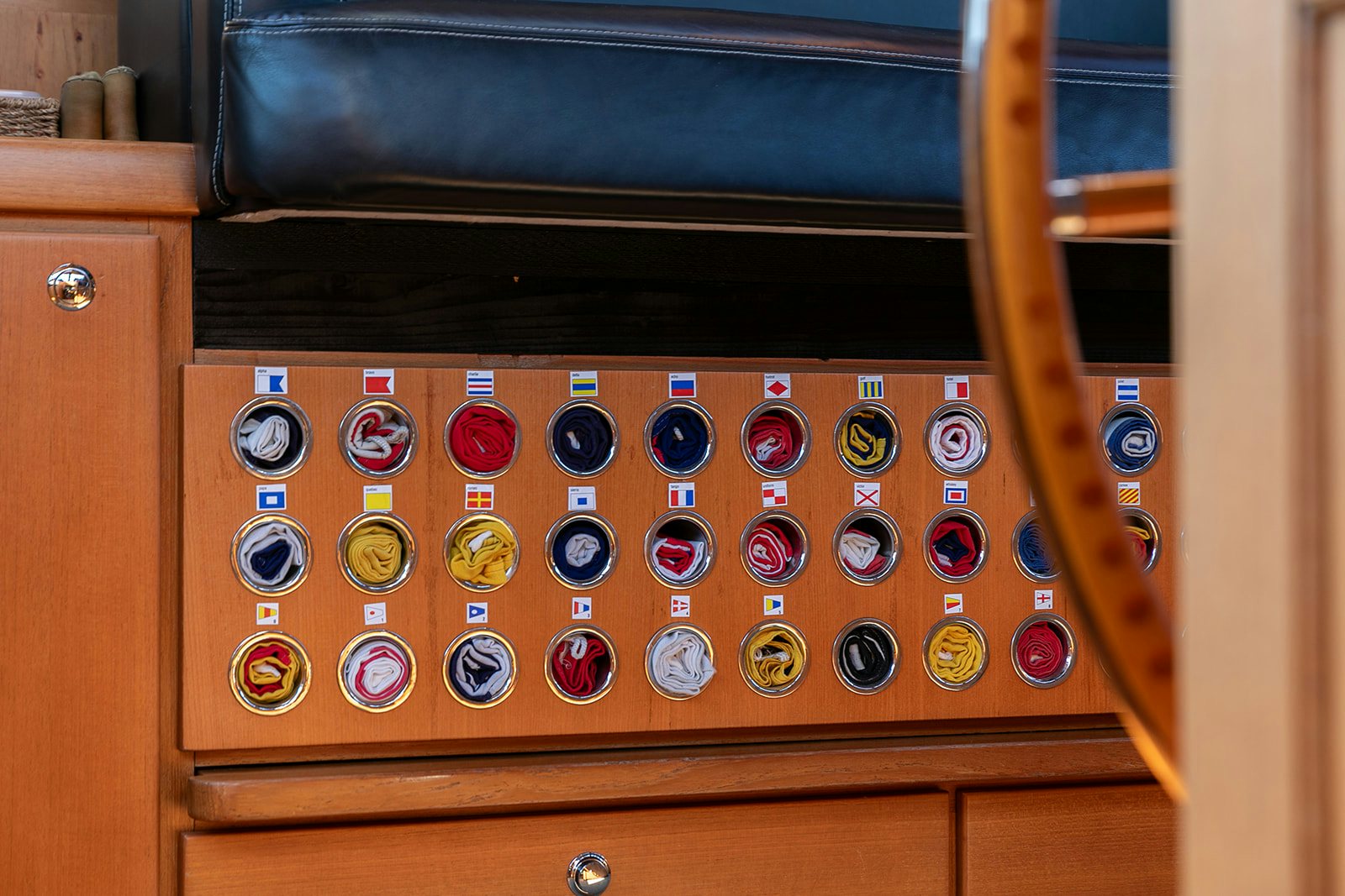 a wooden cabinet with knobs aboard NORFOLK STAR Yacht for Sale