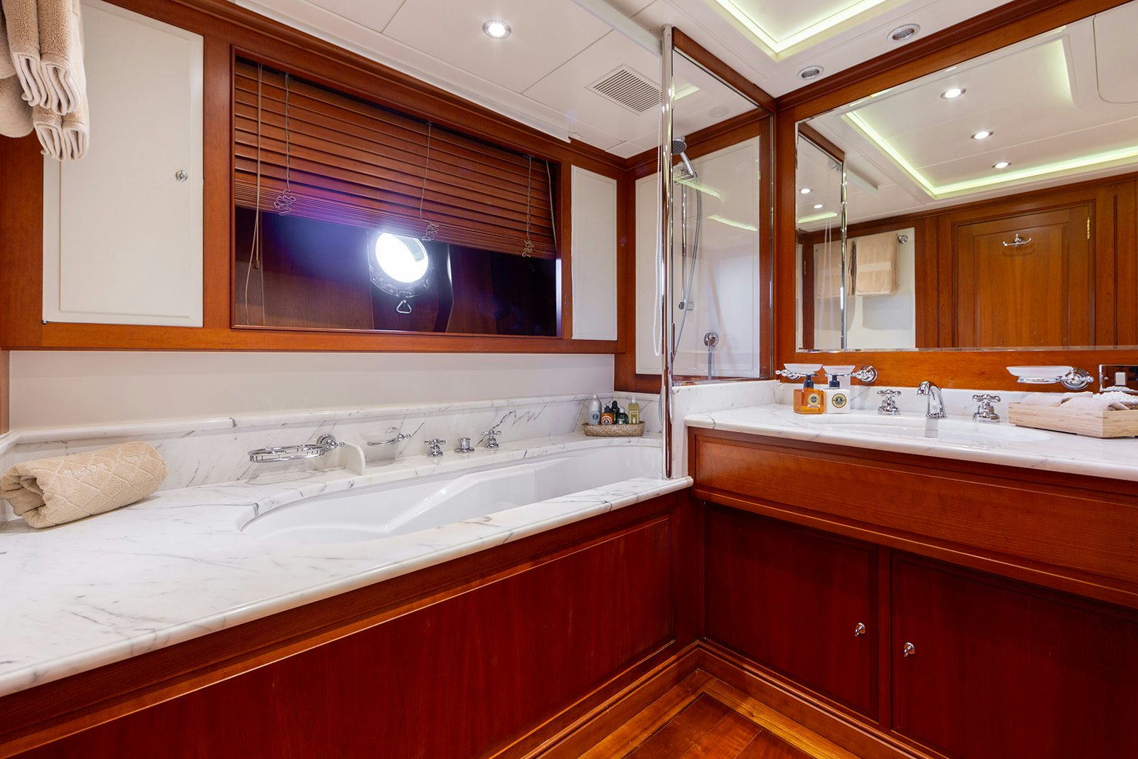 a bathroom with a large mirror aboard NORFOLK STAR Yacht for Sale
