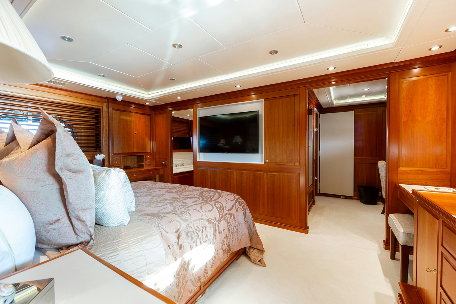 a bedroom with a bed and a television aboard NORFOLK STAR Yacht for Sale