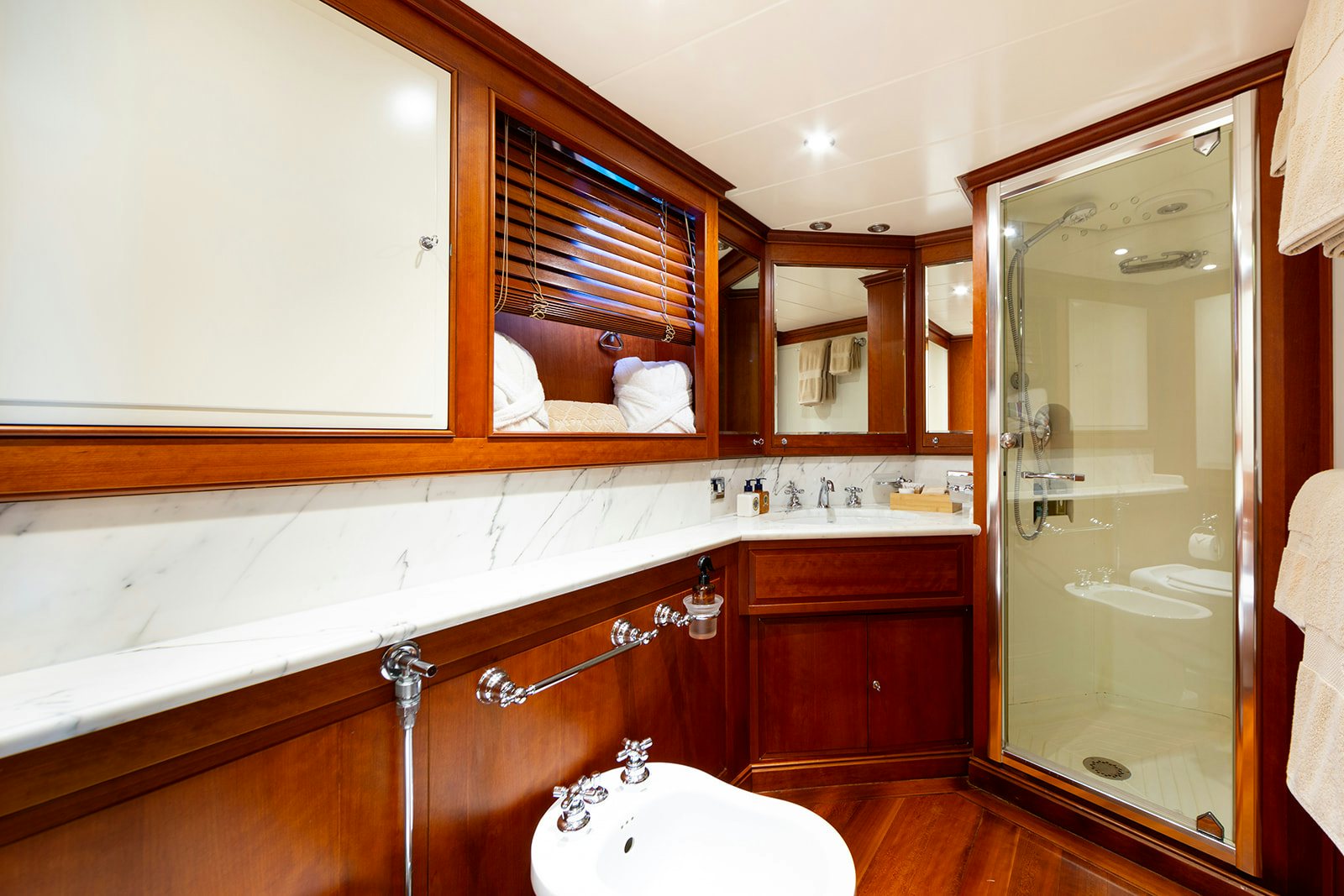 a bathroom with a large mirror aboard NORFOLK STAR Yacht for Sale