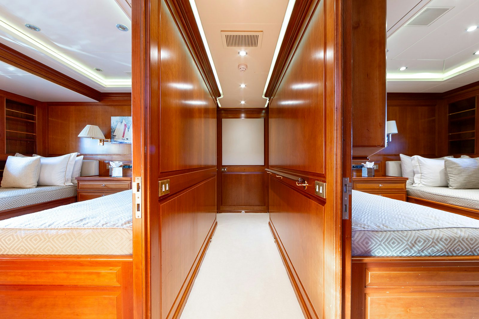 a room with a bed and a closet aboard NORFOLK STAR Yacht for Sale