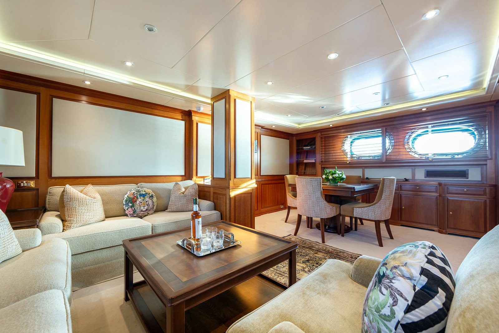 a living room with a couch and a table aboard NORFOLK STAR Yacht for Sale