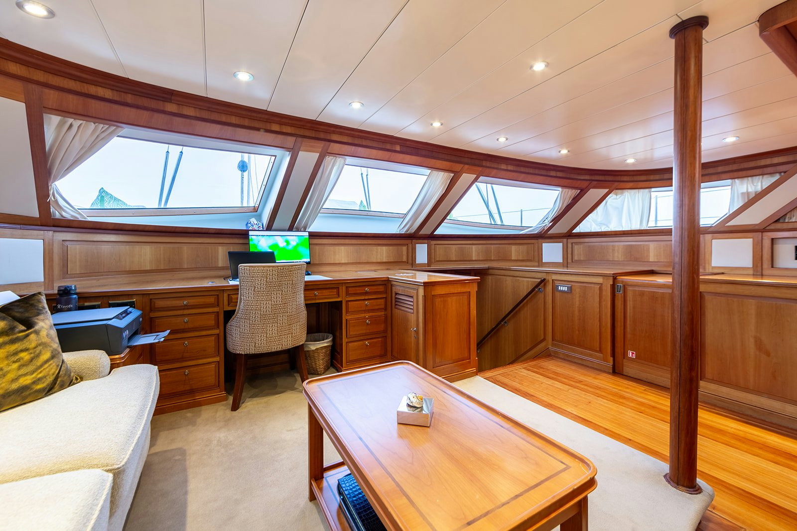 a room with wood floors and a table and chairs aboard NORFOLK STAR Yacht for Sale