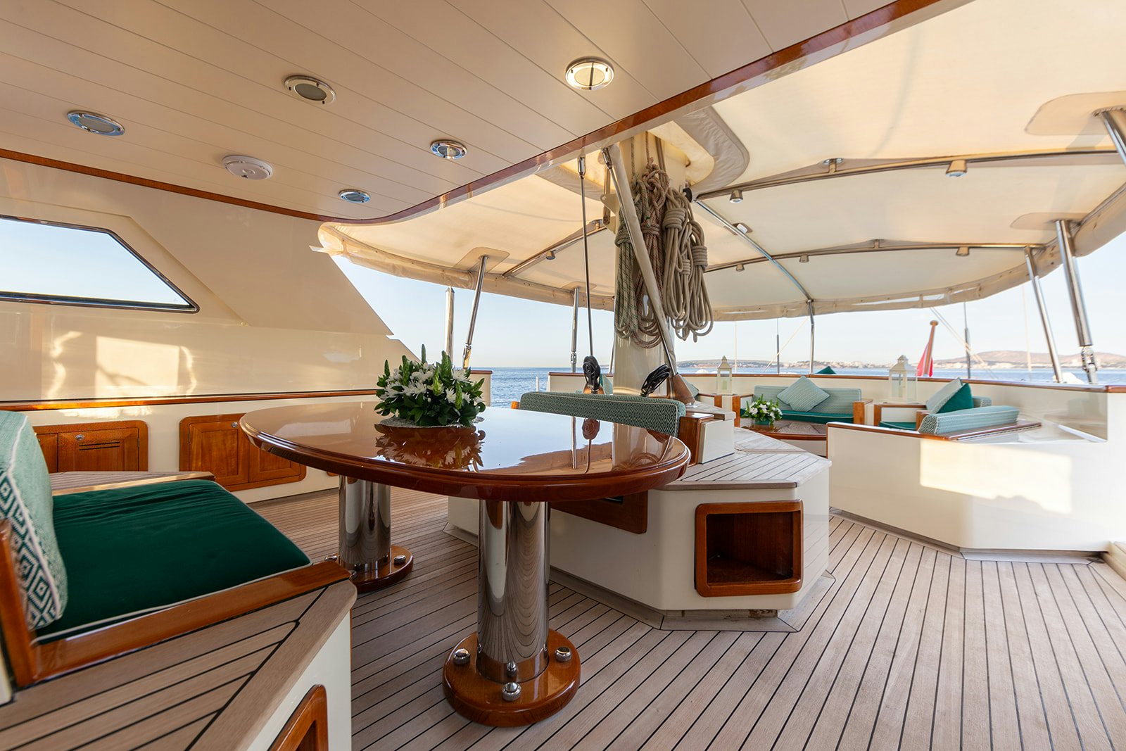 a boat with a table and chairs aboard NORFOLK STAR Yacht for Sale