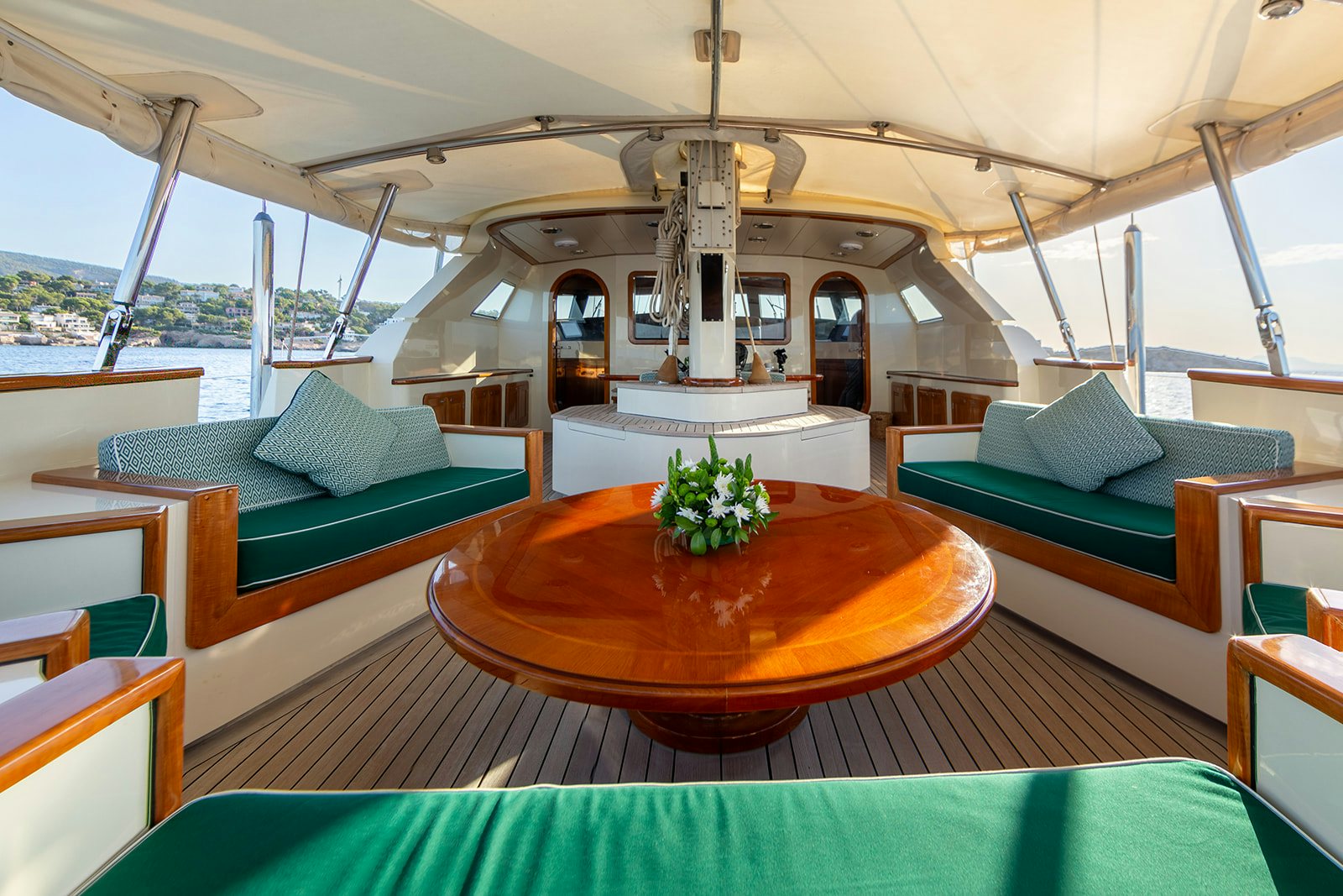 a room with a table and couches aboard NORFOLK STAR Yacht for Sale