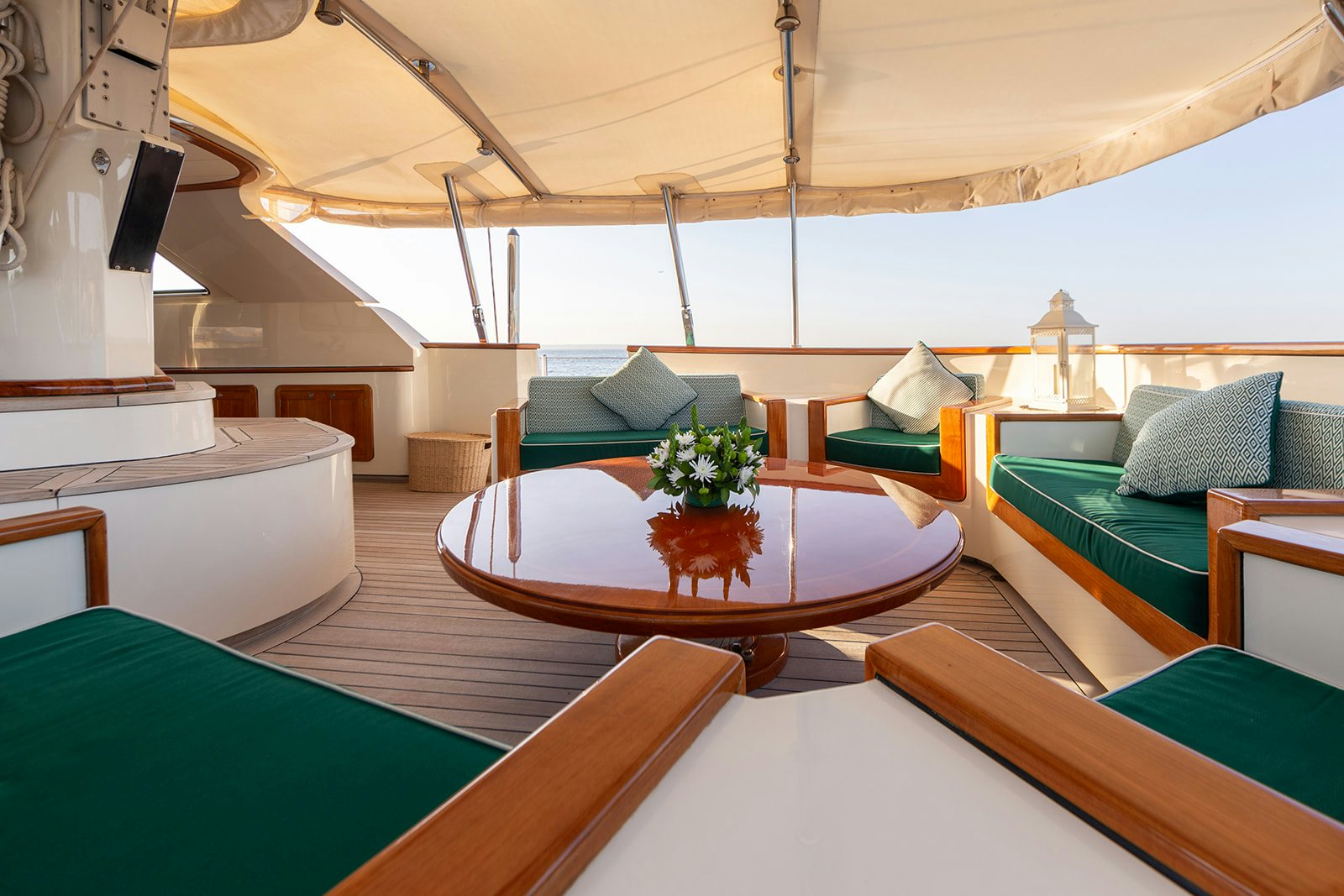 a room with a table and couches aboard NORFOLK STAR Yacht for Sale