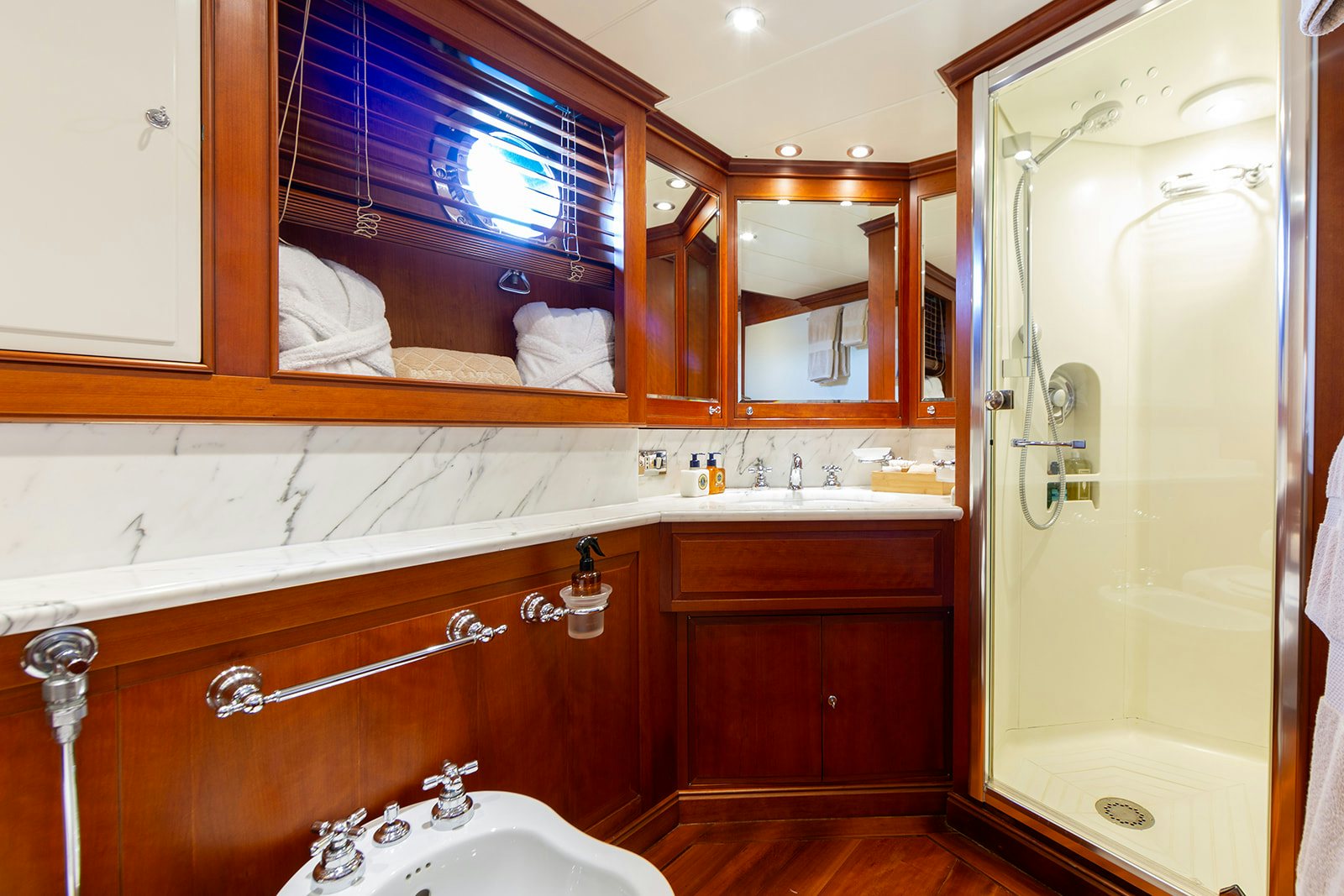 a bathroom with a large mirror aboard NORFOLK STAR Yacht for Sale