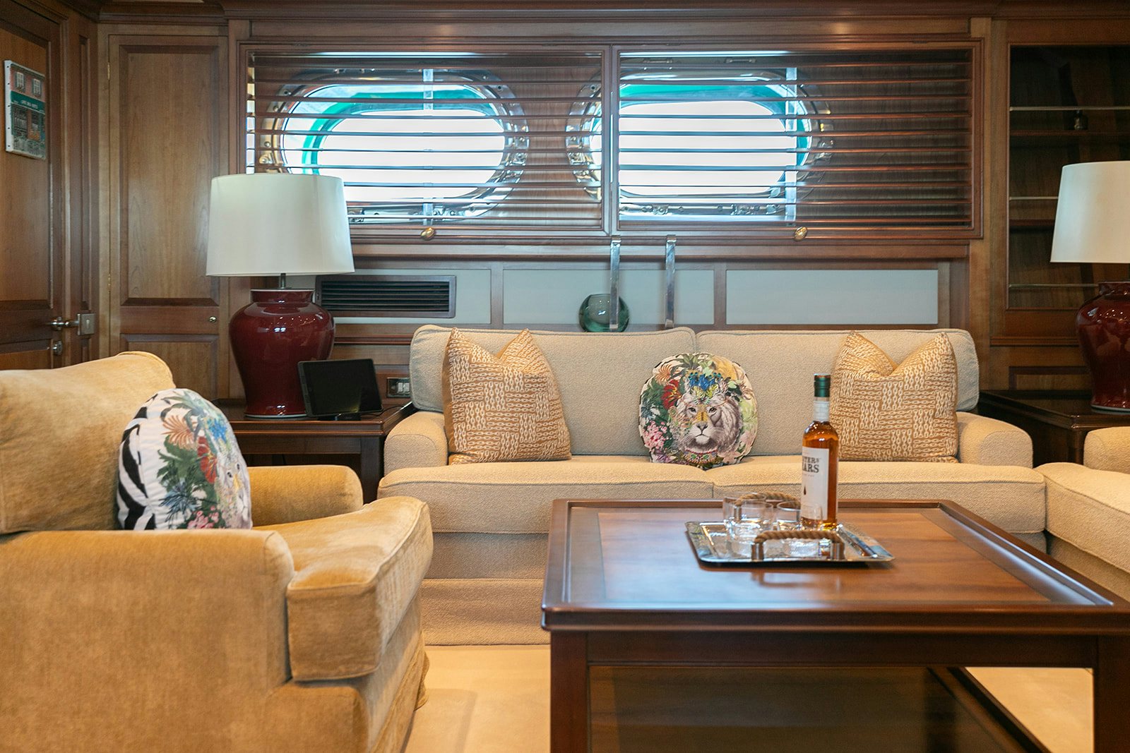 a living room with a couch and a coffee table aboard NORFOLK STAR Yacht for Sale