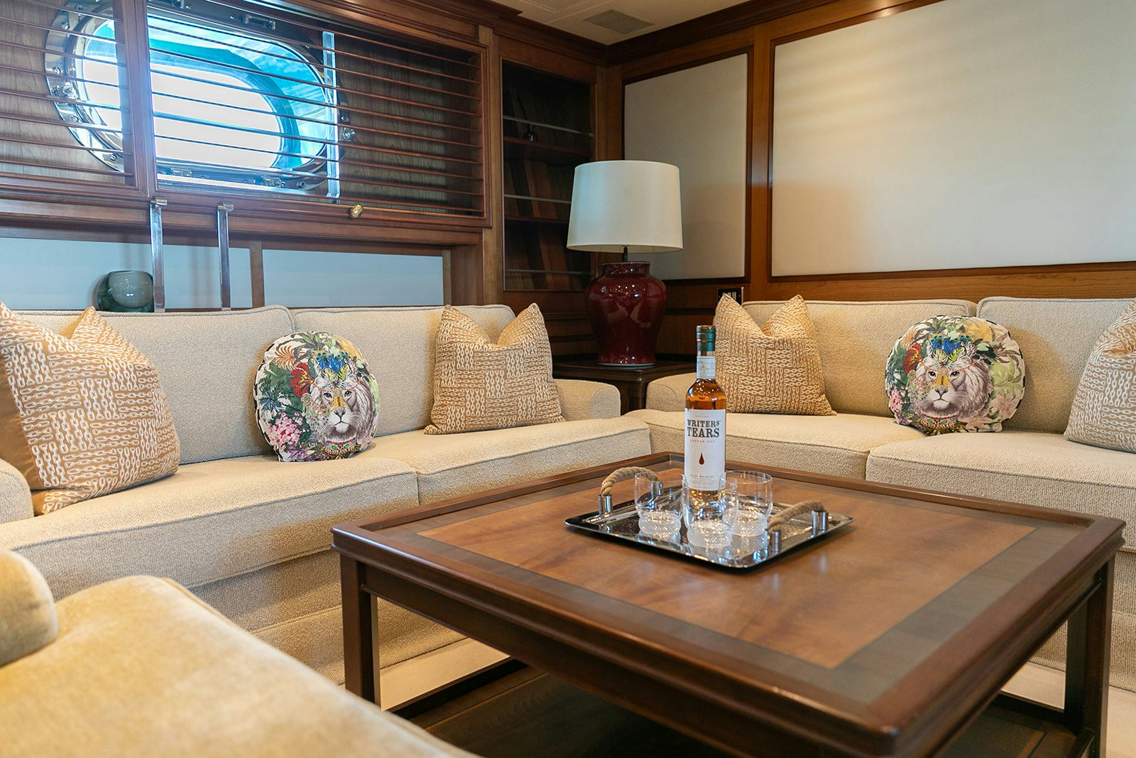 a living room with a couch and coffee table aboard NORFOLK STAR Yacht for Sale