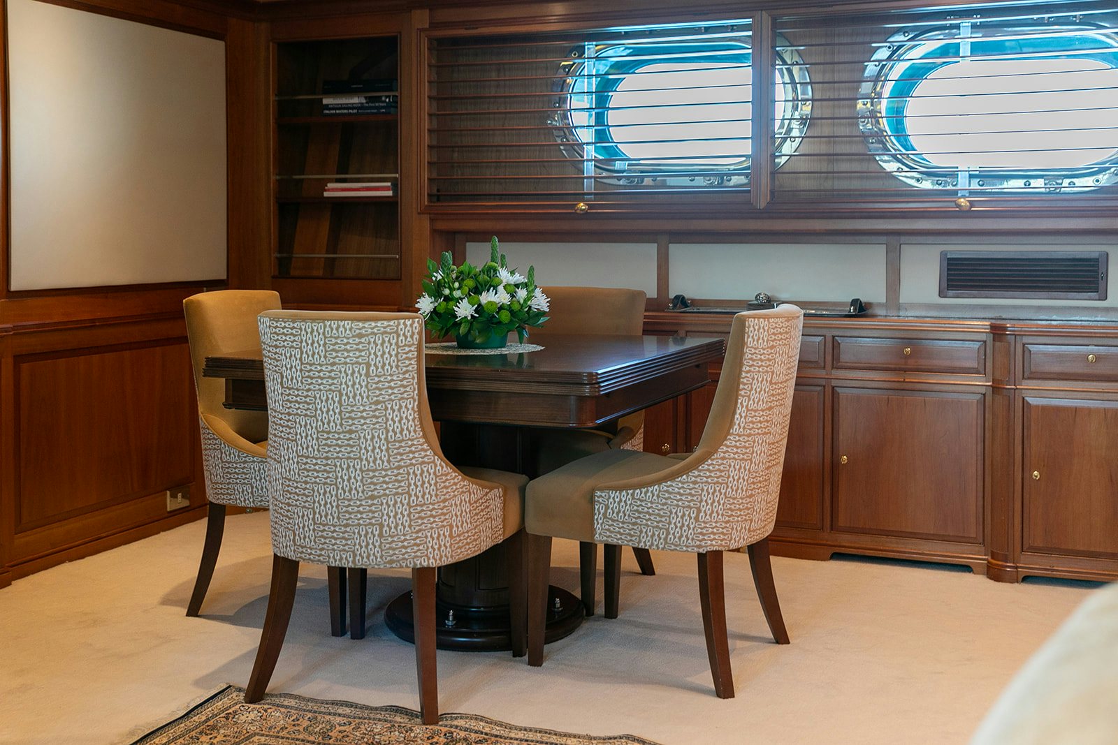 a room with a table and chairs aboard NORFOLK STAR Yacht for Sale