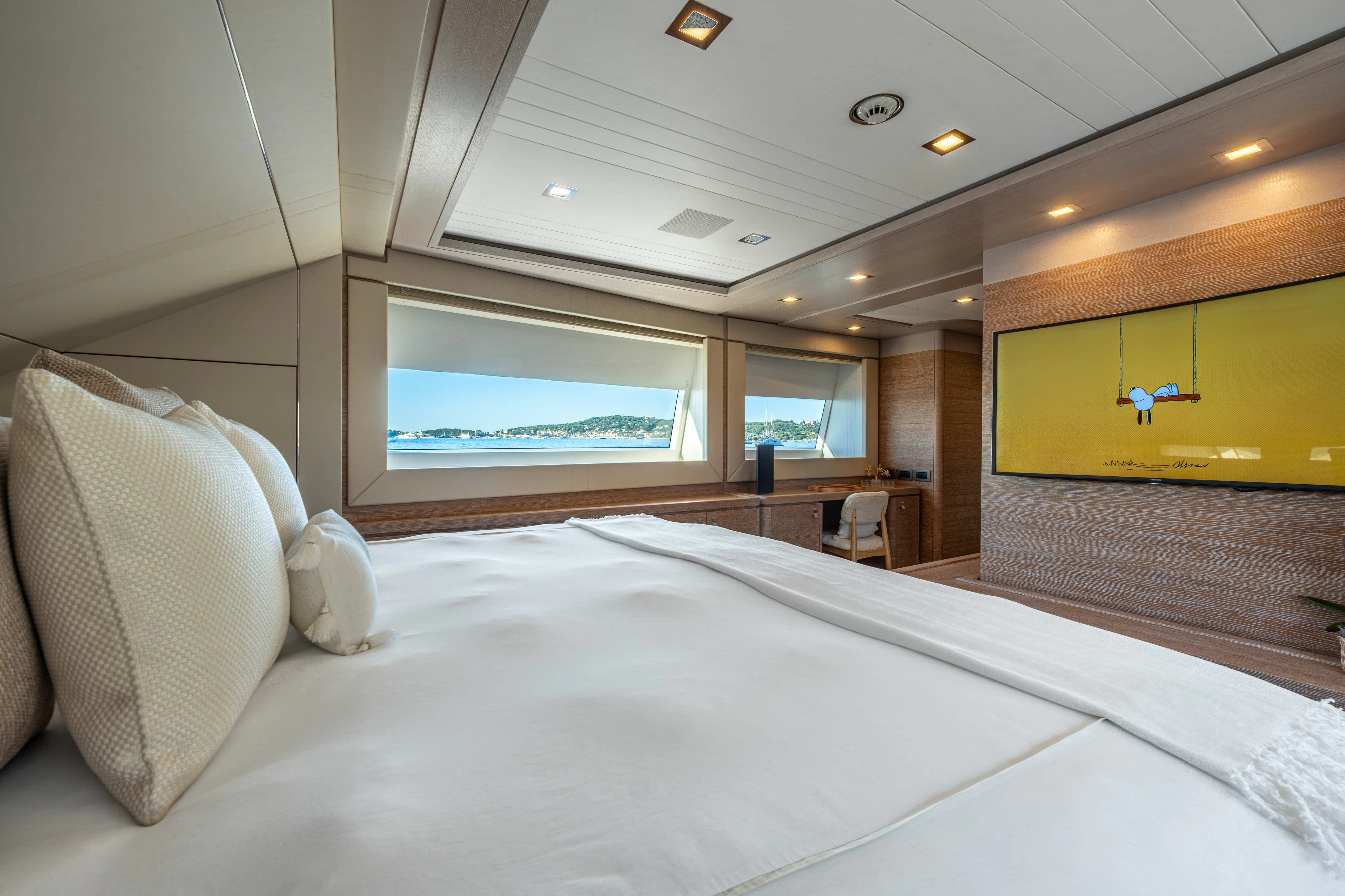 a large bed in a room aboard CENTURION Yacht for Sale
