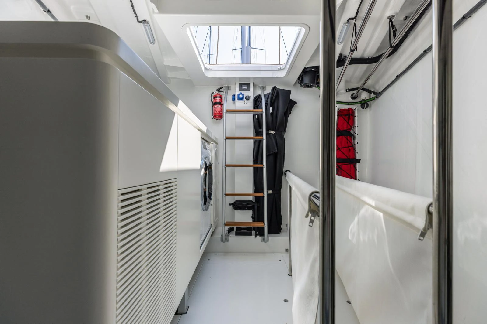 a hallway with white walls and a staircase aboard WINDROCKER Yacht for Sale