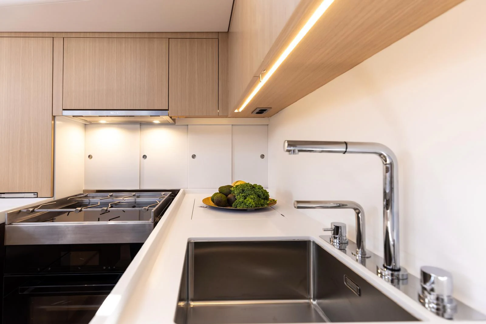 a kitchen with a bowl of fruit aboard WINDROCKER Yacht for Sale