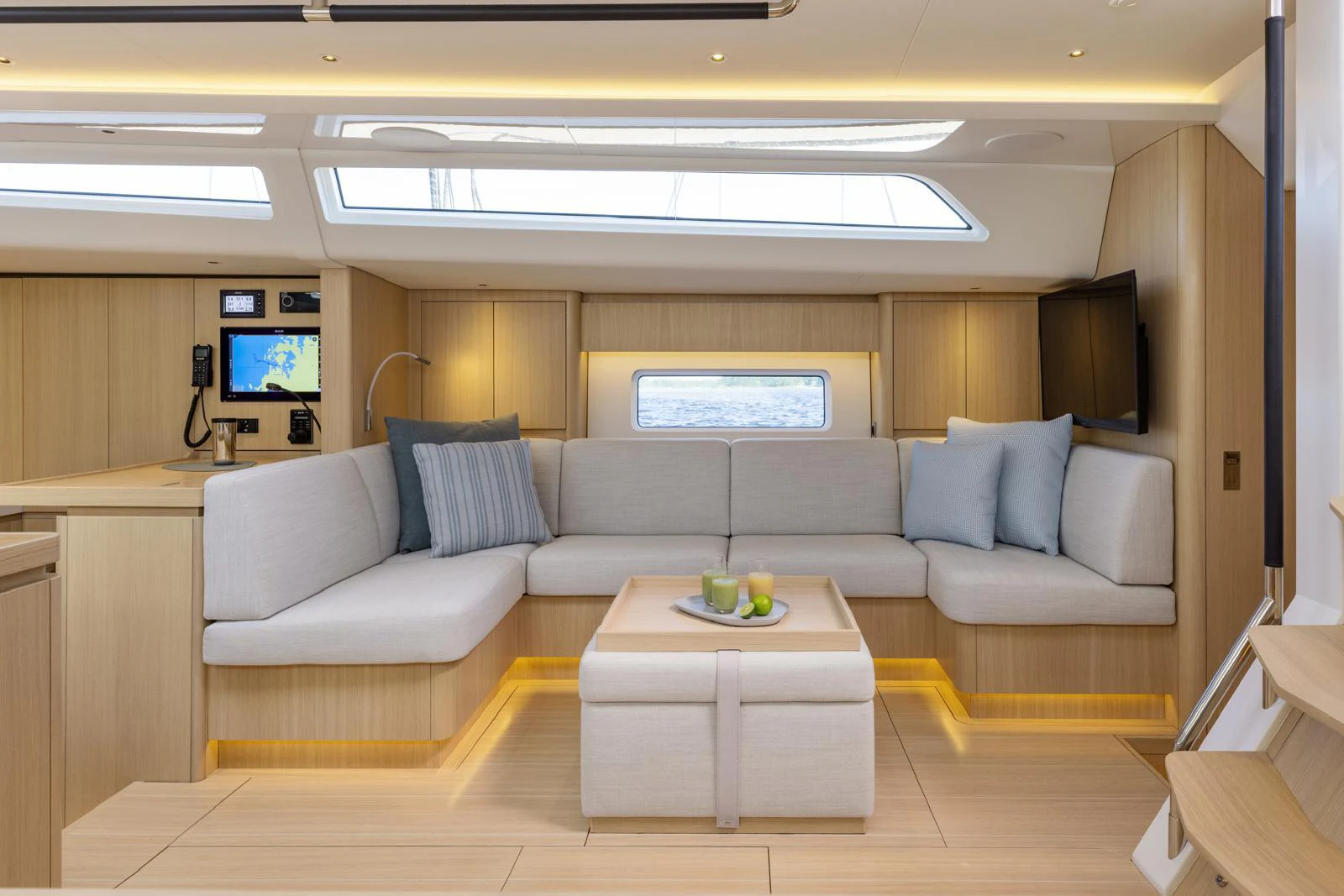 a living room with a couch and a tv aboard WINDROCKER Yacht for Sale
