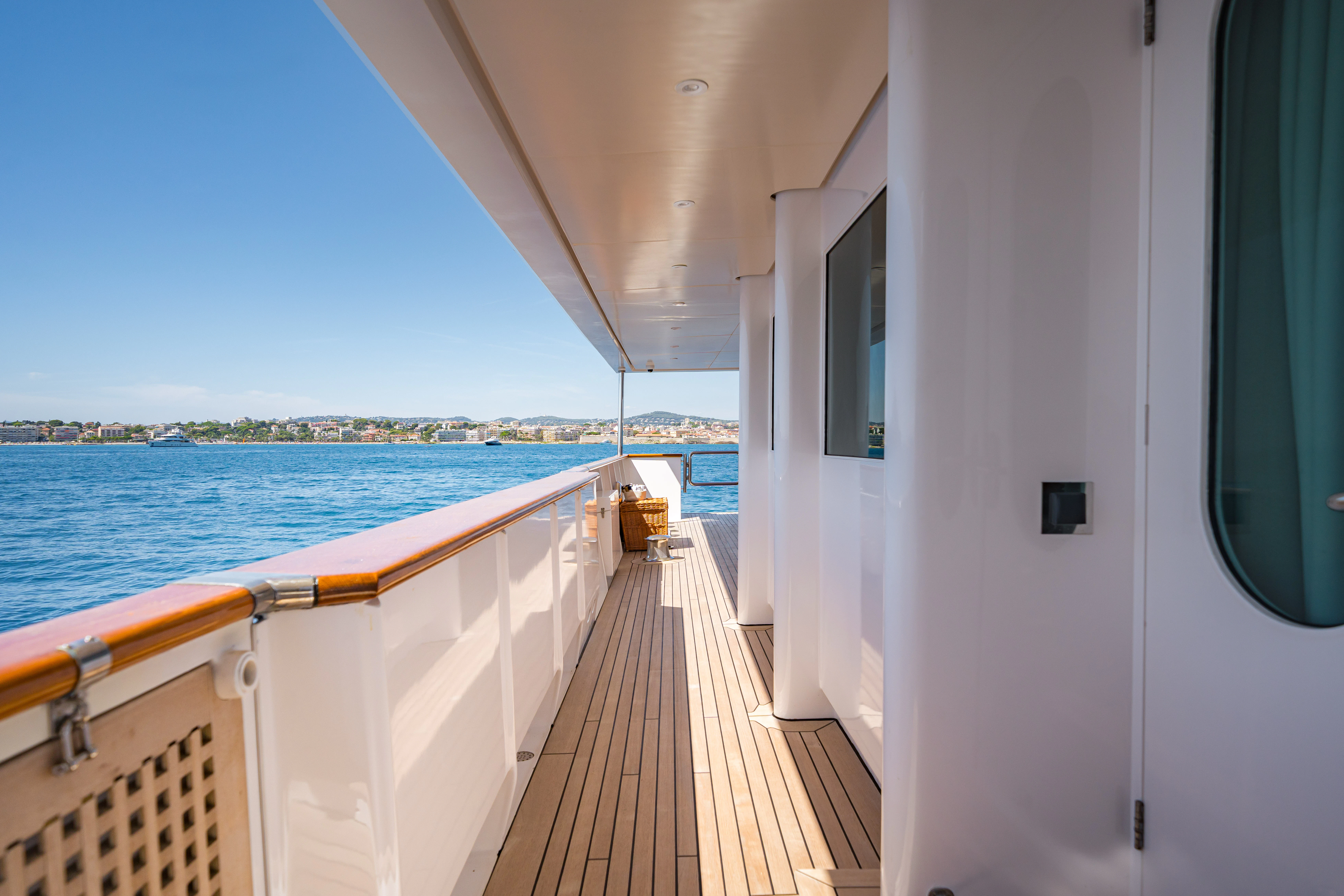 a deck with a view of the water and the city aboard KORU Yacht for Sale