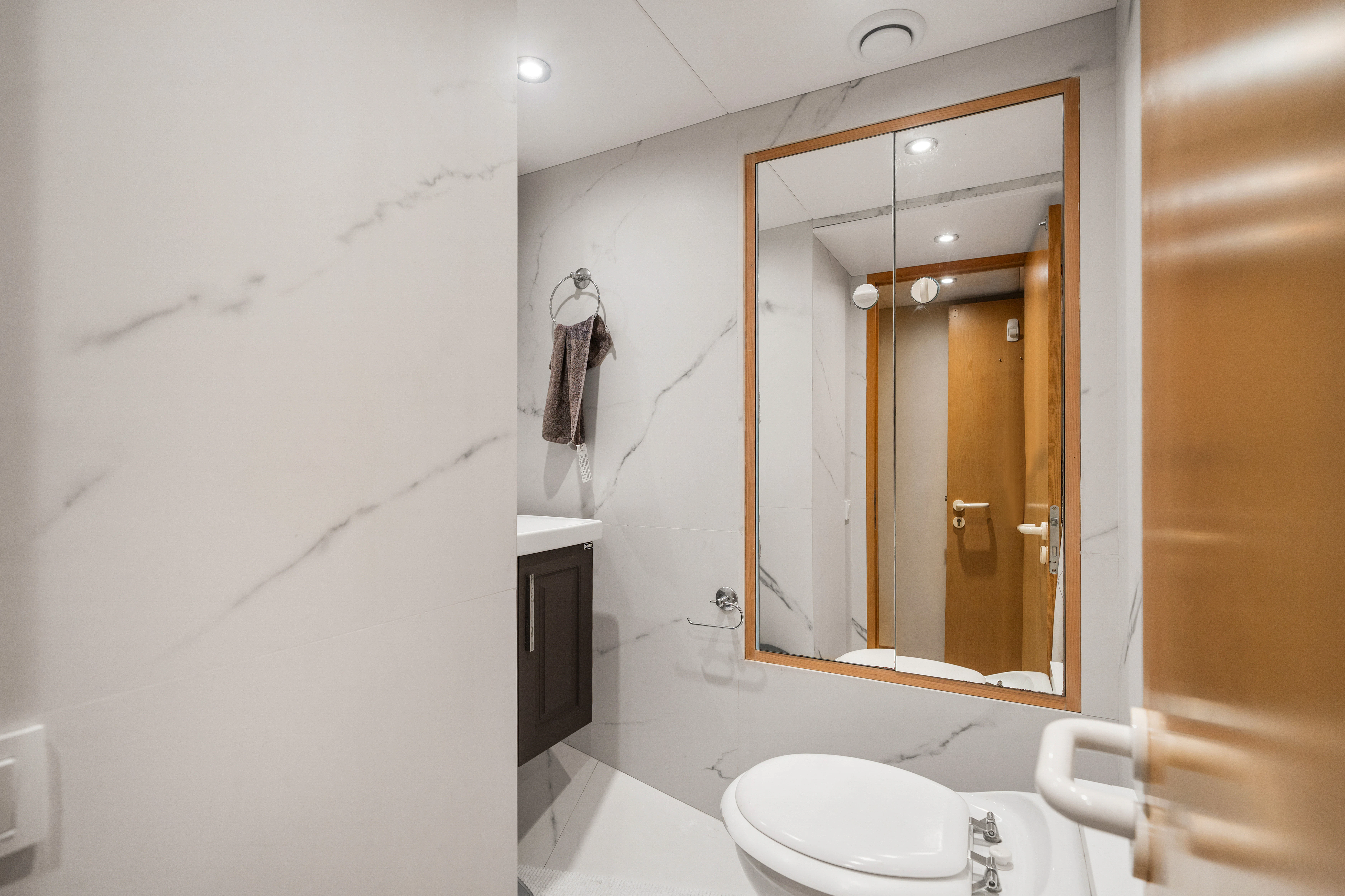 a bathroom with a mirror aboard KORU Yacht for Sale