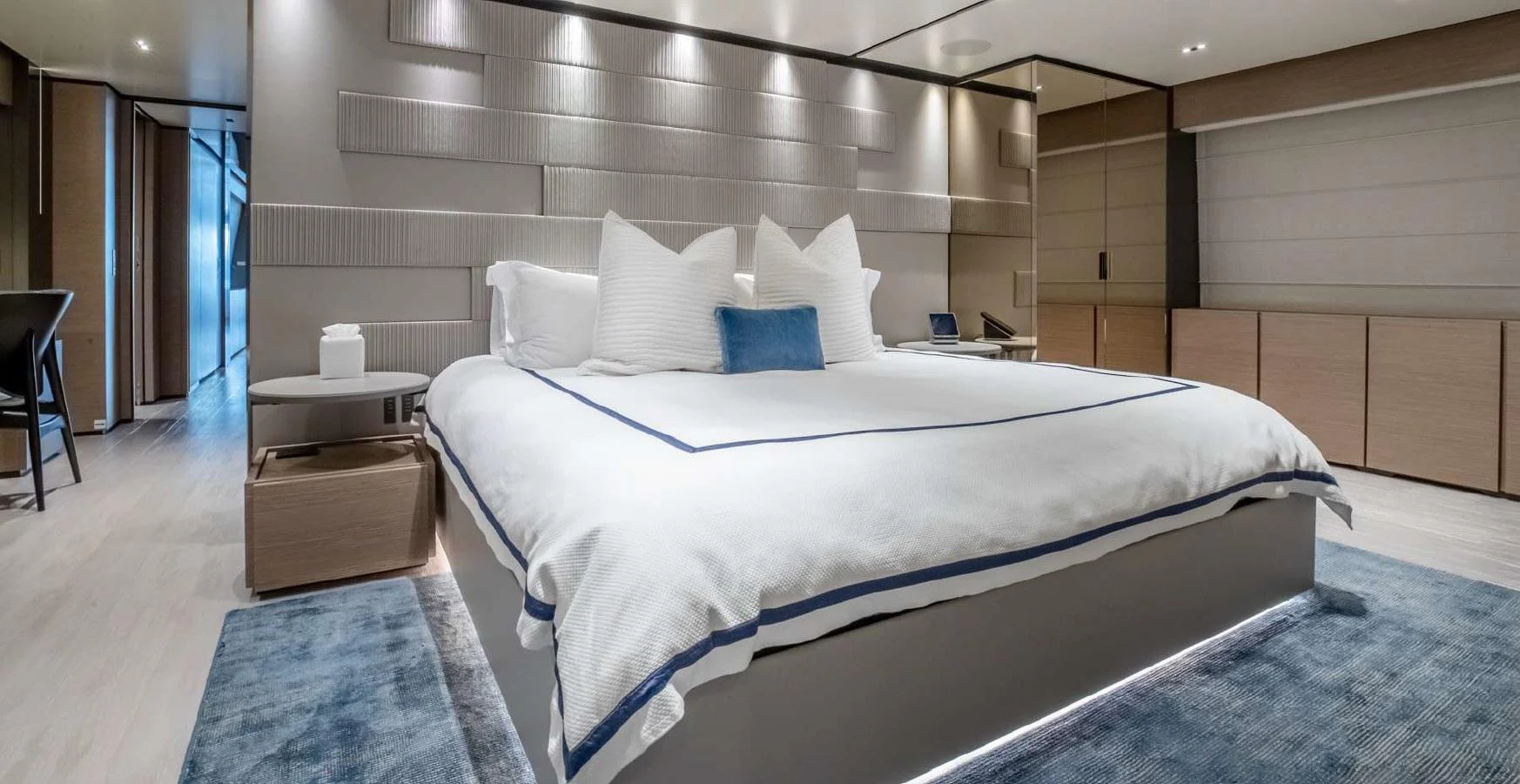 a large bed in a room aboard COFINA Yacht for Charter