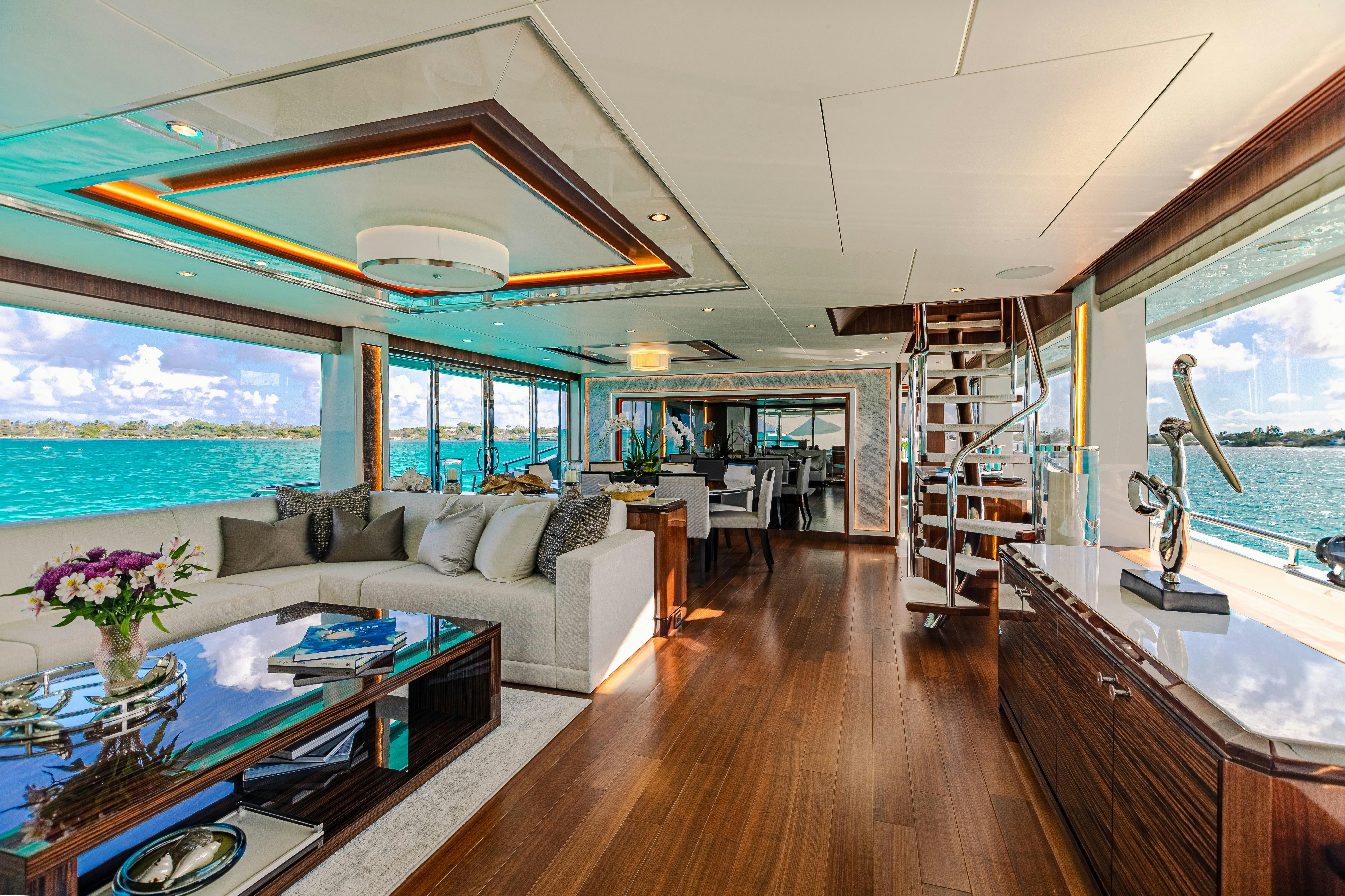 a living room with a large window aboard I C Yacht for Charter