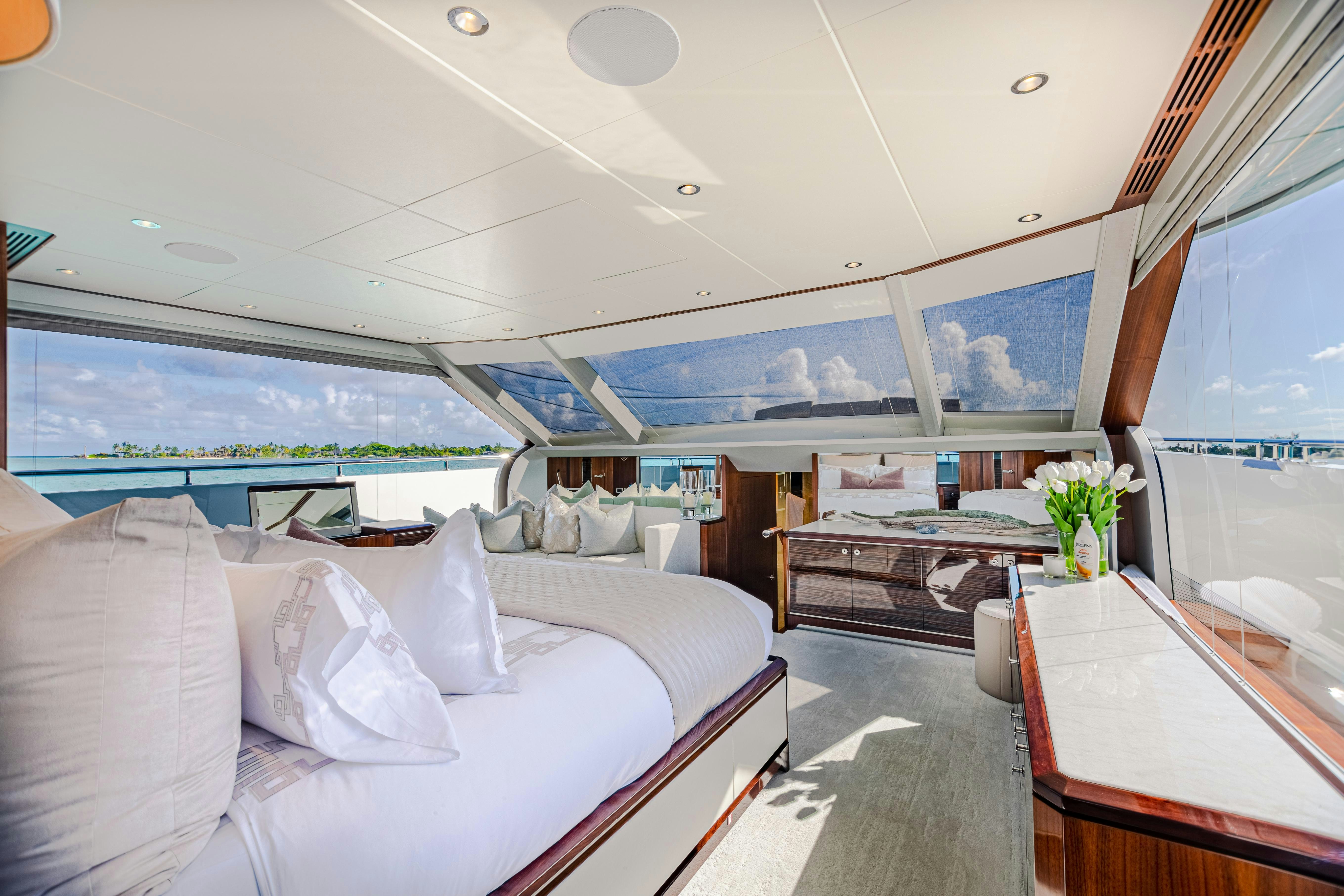 a room with a bed and a piano aboard I C Yacht for Charter