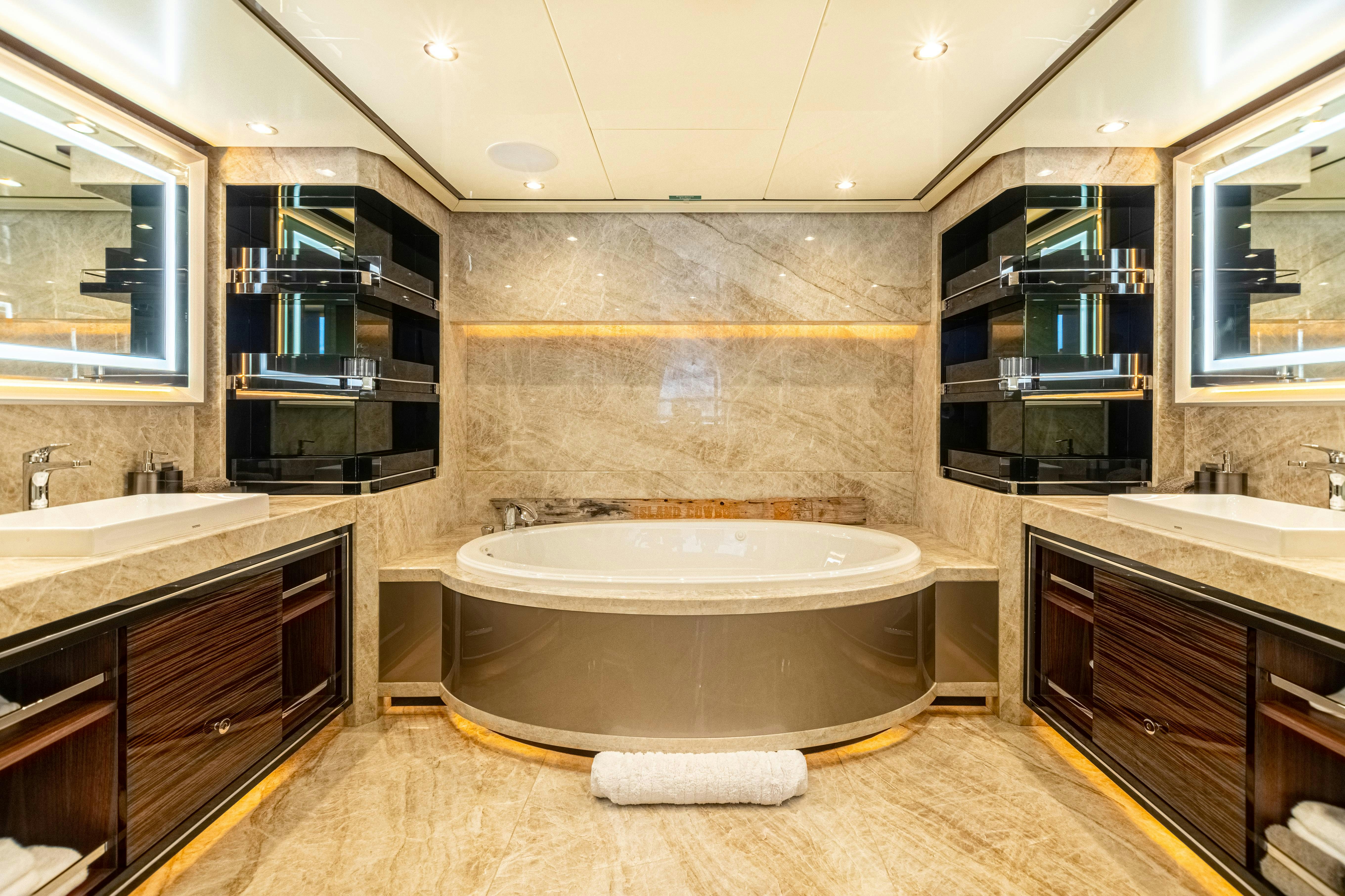 a bathroom with a large bathtub aboard I C Yacht for Charter