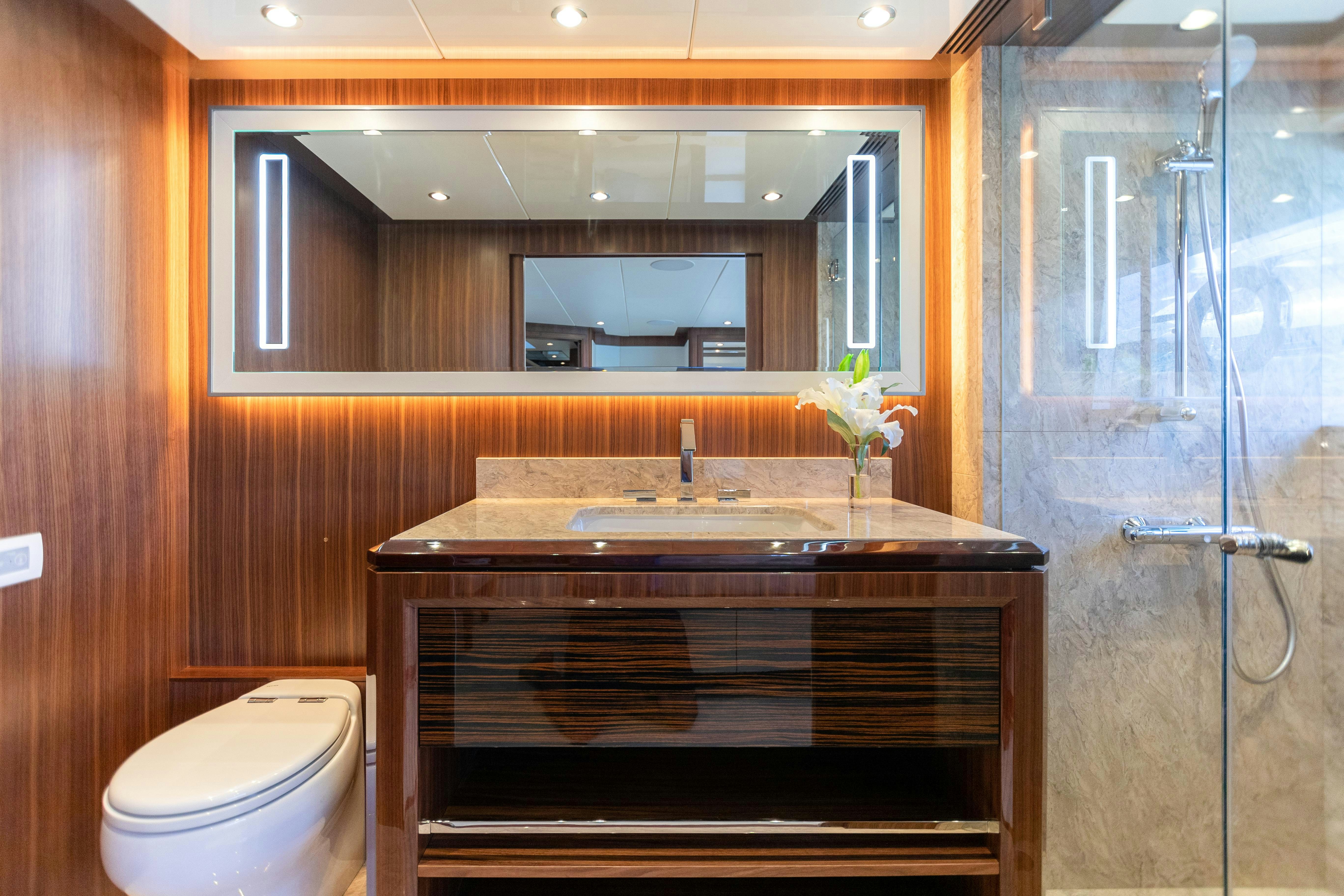 a bathroom with a glass shower aboard I C Yacht for Charter