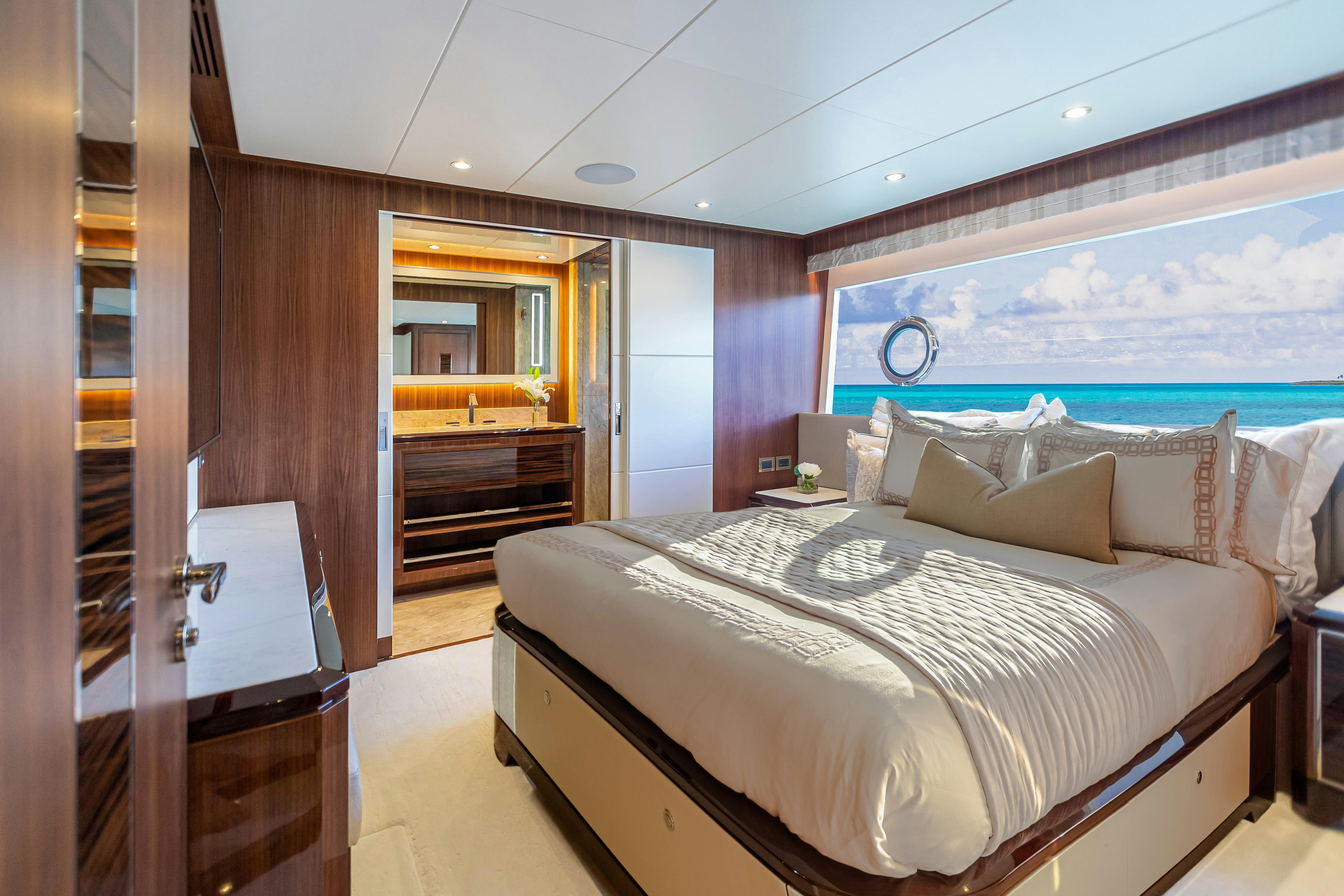 a bedroom with a bed and a large mirror aboard I C Yacht for Charter