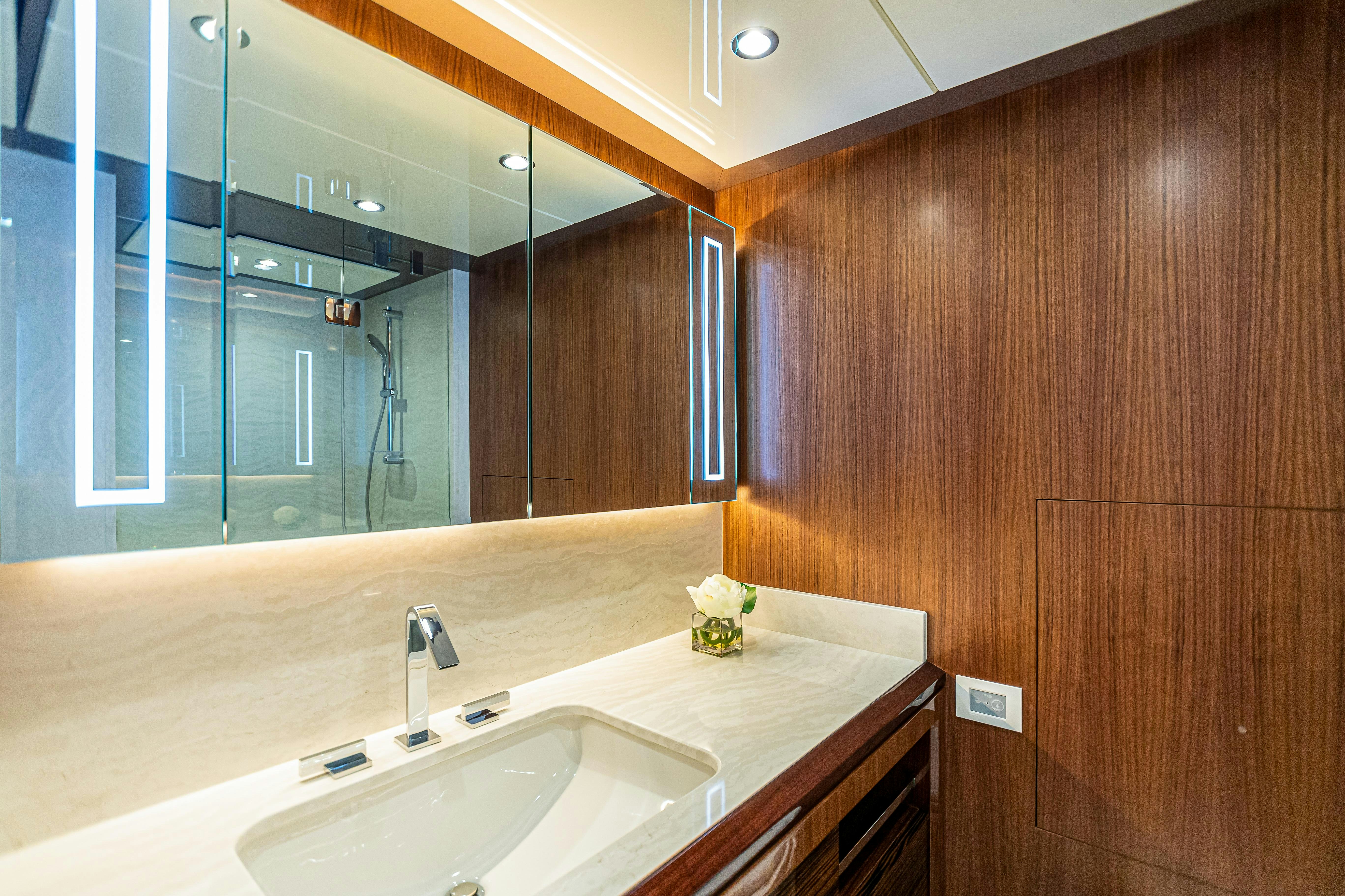 a bathroom with a large mirror aboard I C Yacht for Charter