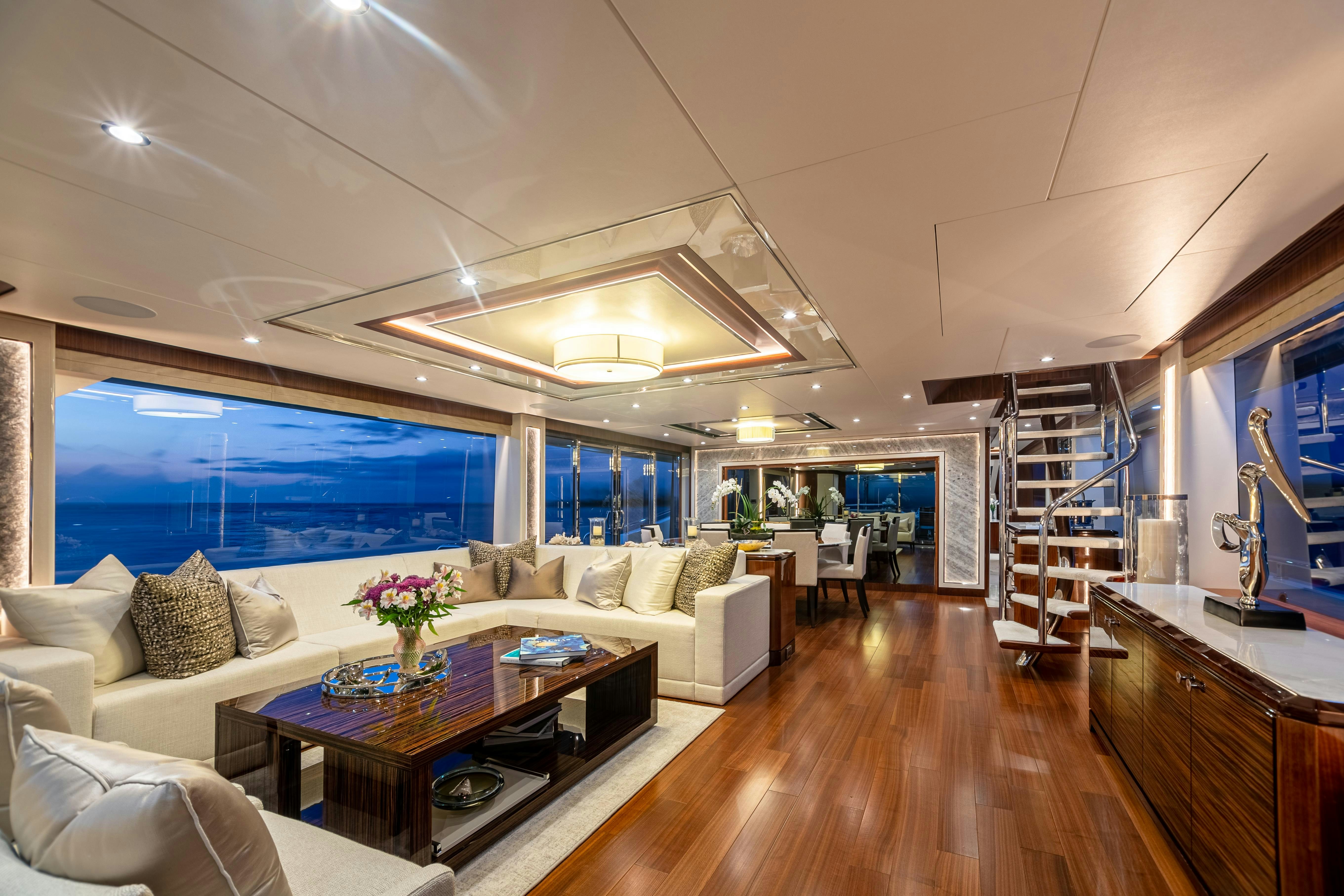 a living room with a large window aboard I C Yacht for Charter