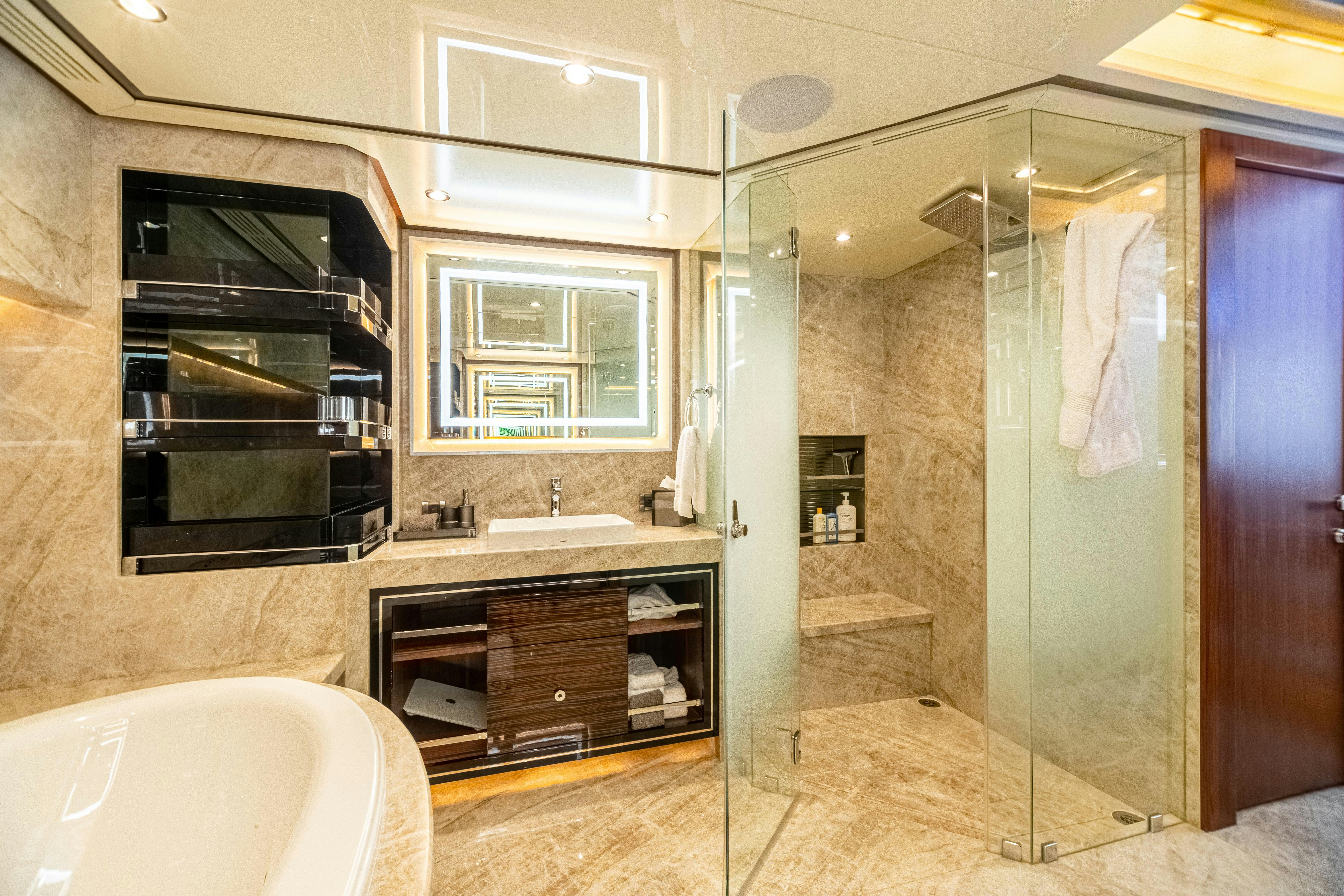 a bathroom with a sink and a bathtub aboard I C Yacht for Charter