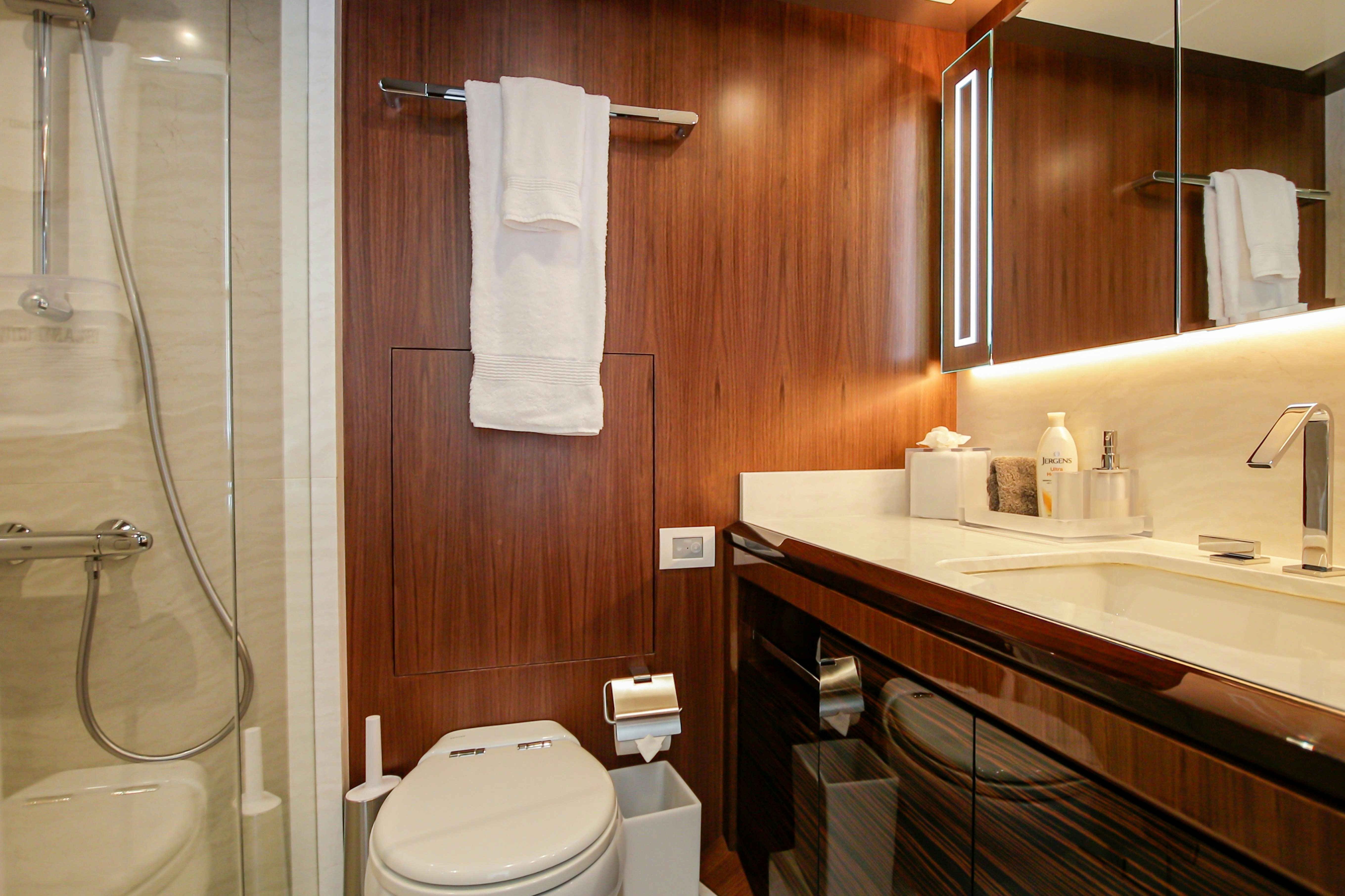 a bathroom with a sink and toilet aboard I C Yacht for Charter