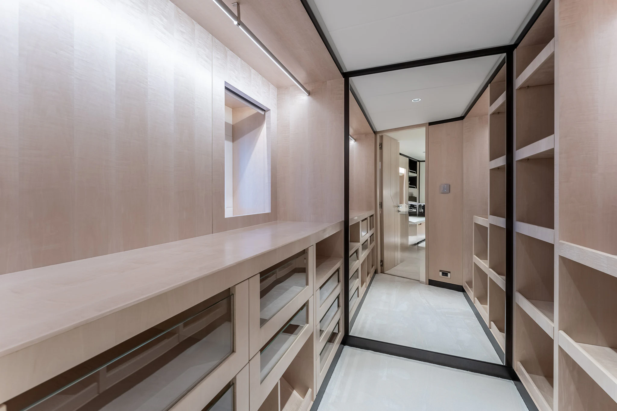a hallway with white cabinets aboard OPTIMISM Yacht for Sale