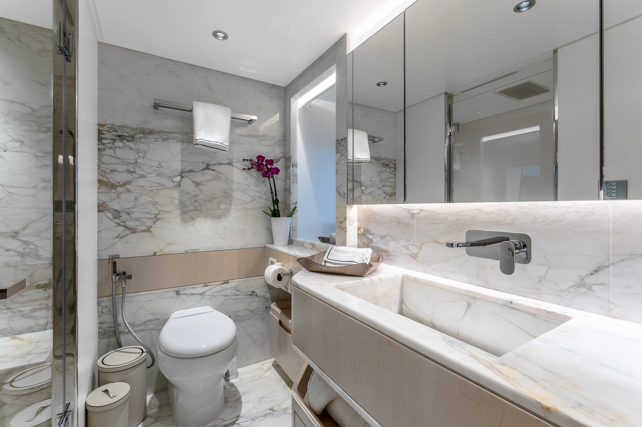 a bathroom with a sink toilet and a bathtub aboard OPTIMISM Yacht for Sale