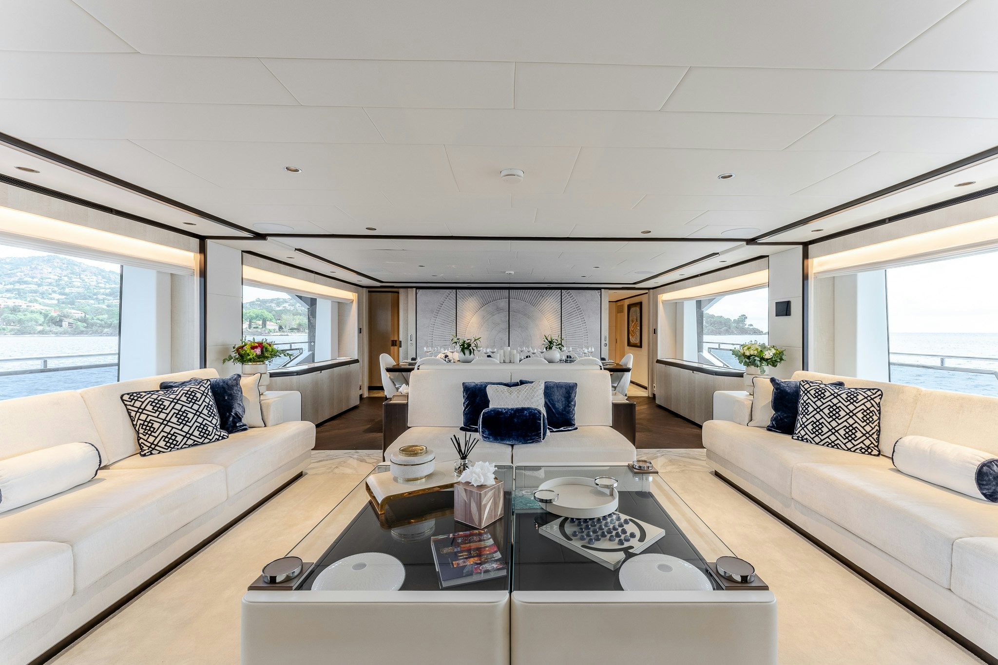 a living room with a large window aboard OPTIMISM Yacht for Charter