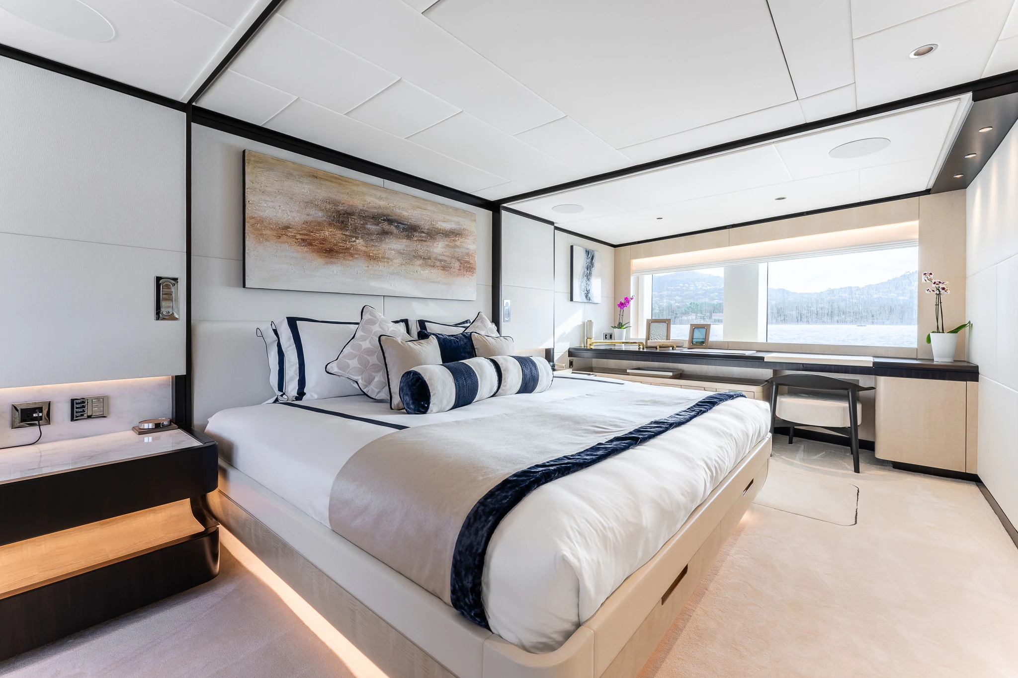 a bedroom with a large bed aboard OPTIMISM Yacht for Sale