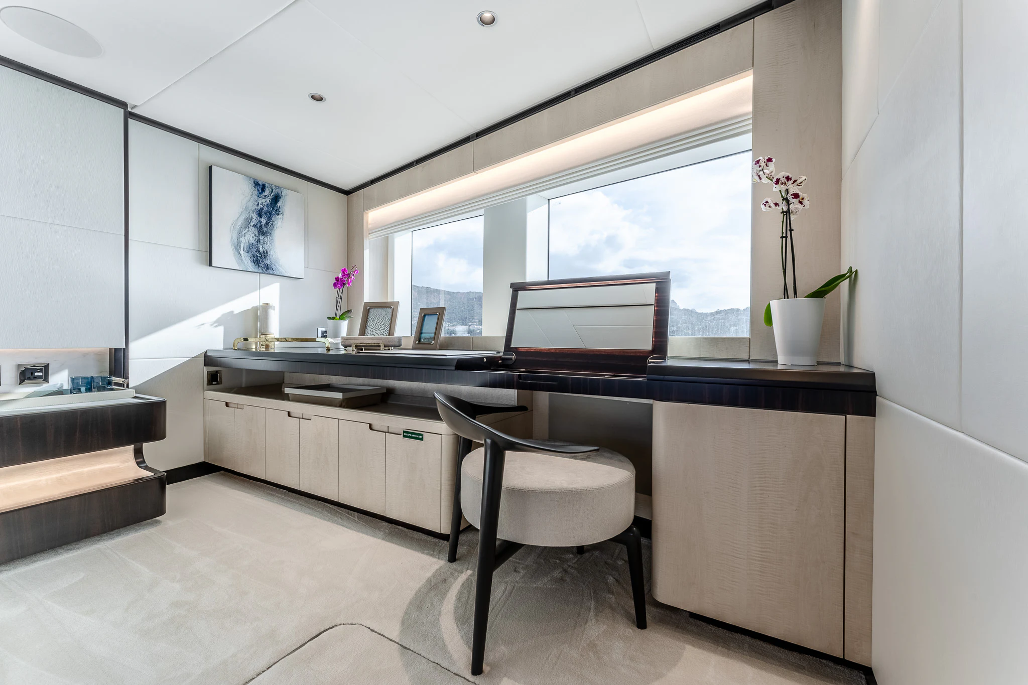 a kitchen with a large window aboard OPTIMISM Yacht for Sale