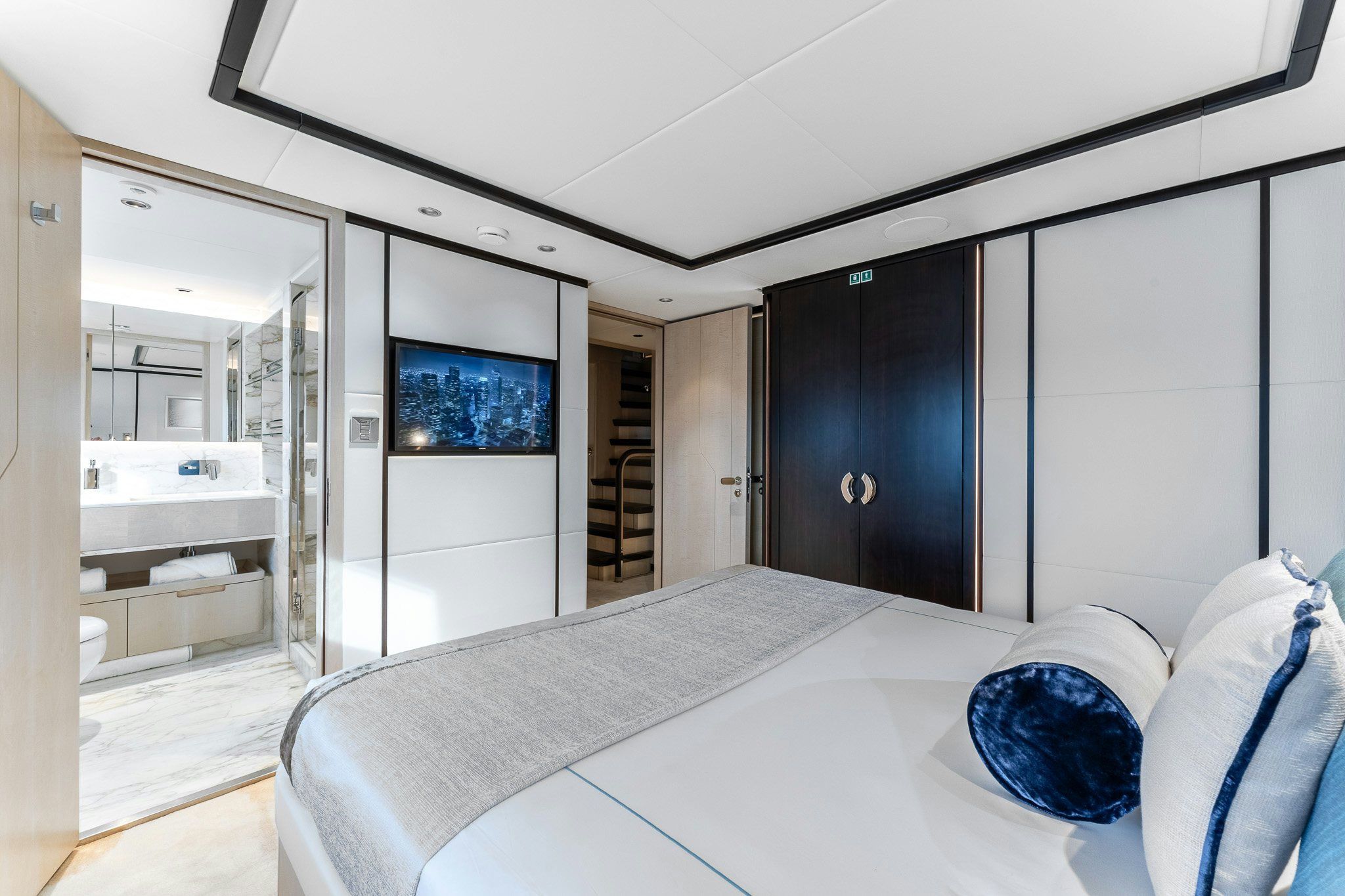 a bed in a room aboard OPTIMISM Yacht for Charter