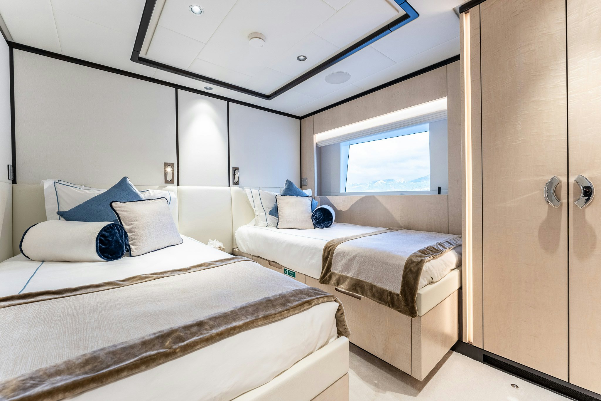 a room with two beds aboard OPTIMISM Yacht for Charter