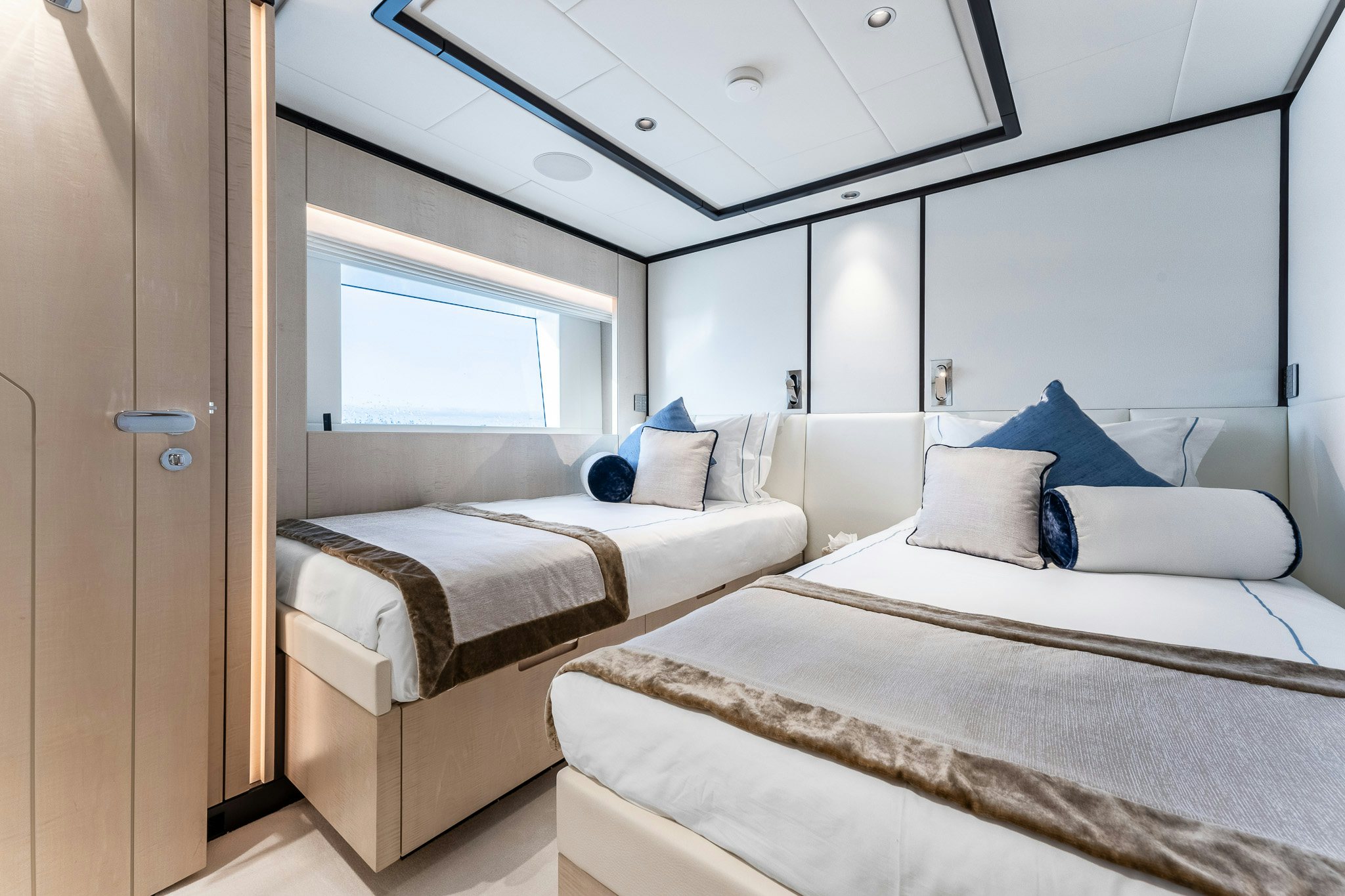 a room with two beds aboard OPTIMISM Yacht for Charter