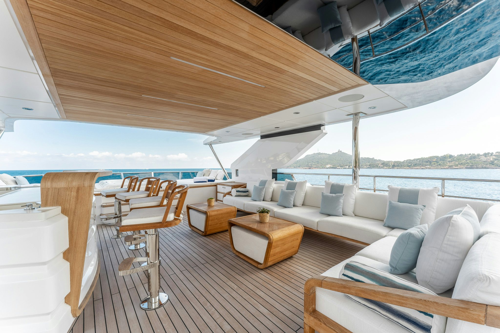 a room with a couch and a table and chairs aboard OPTIMISM Yacht for Charter